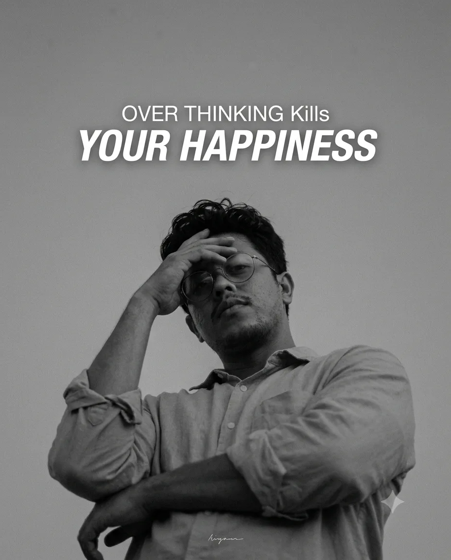Minimalist moody black-and-white cinematic portrait of a young man photographed from a dramatic low angle against a vast plain gray sky,