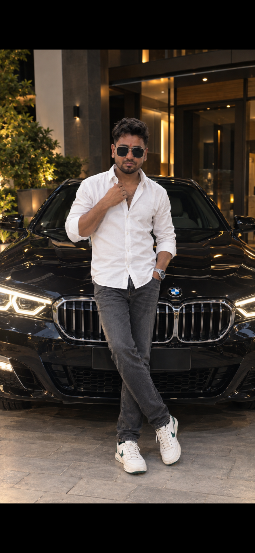 Create an ultra-realistic, high-quality 4K UHD full-body luxury fashion photograph of a stylish young Indian man standing confidently in