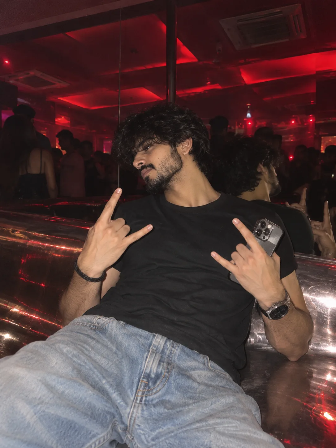 Ultra realistic close-up flash photo of ^ a young man (based on reference photo) in a dark nightclub, his body leaning diagonally to the