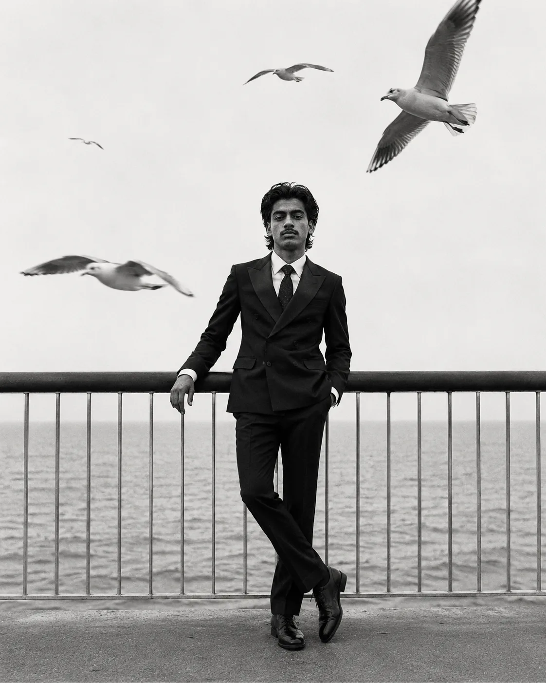 Exact Image Recreation Prompt Create a highly photorealistic cinematic black-and-white fashion editorial photograph of a stylish young
