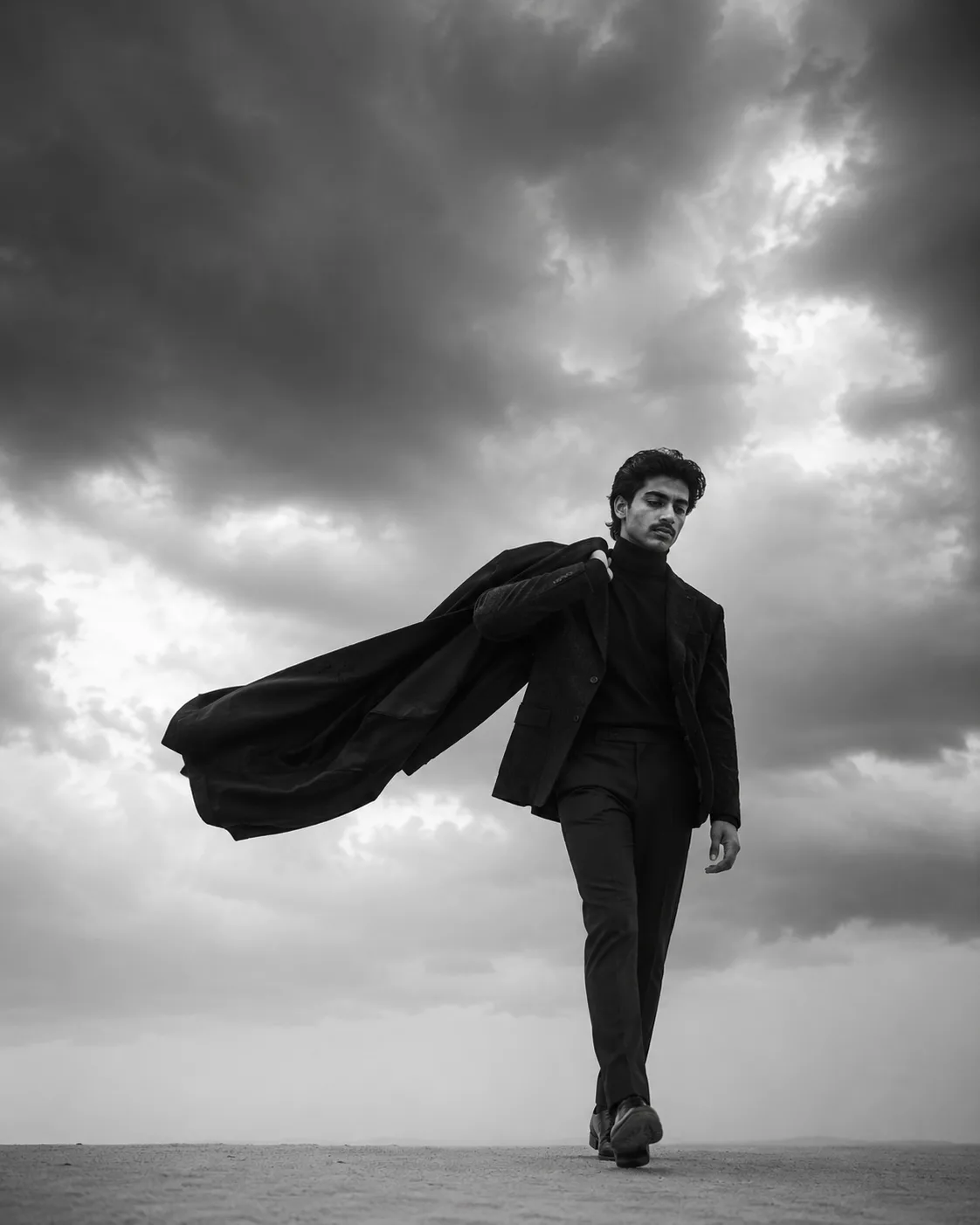 Exact Image Recreation Prompt Create a highly photorealistic cinematic black-and-white fashion editorial photograph of a stylish young