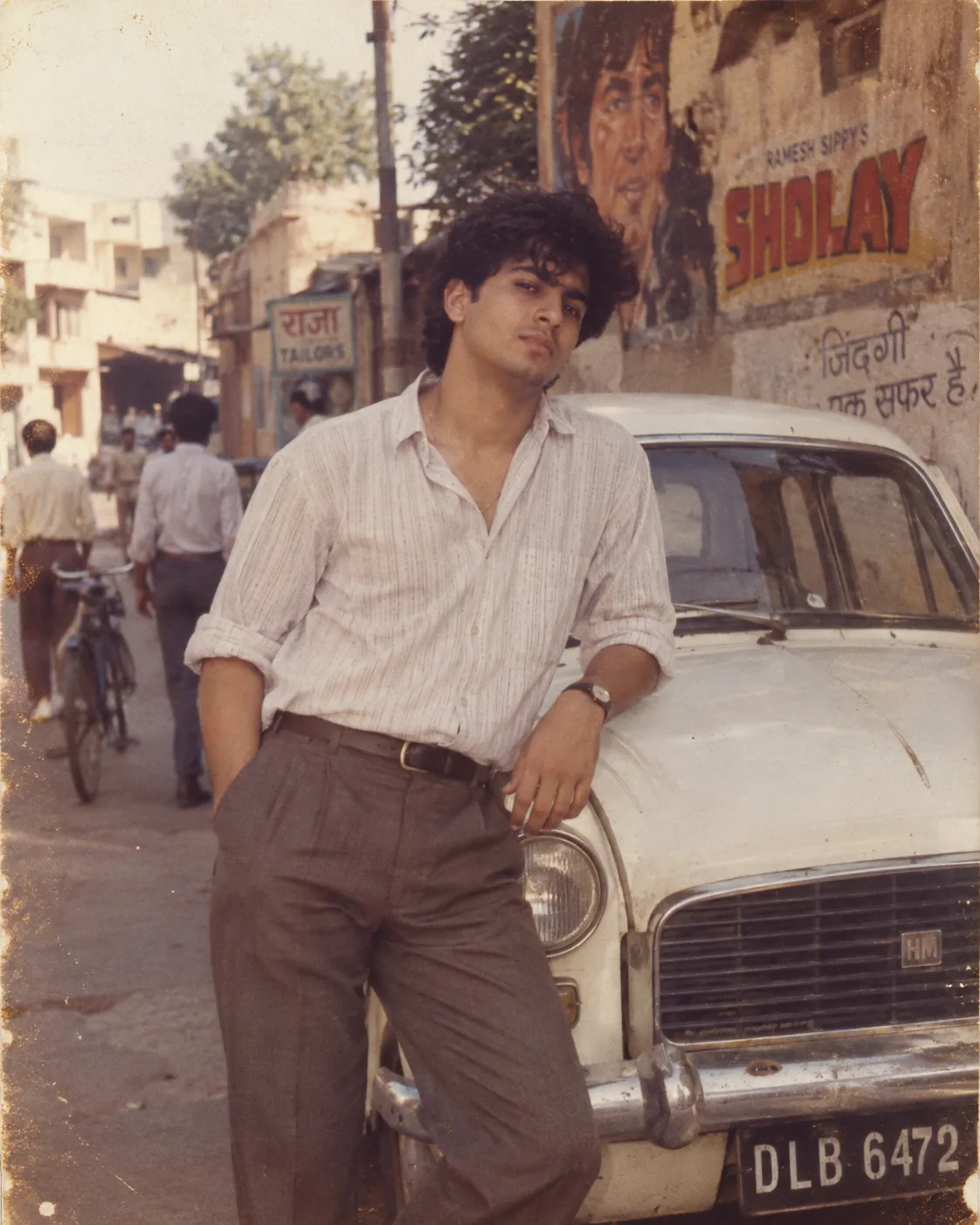 Use the uploaded photo as the strict identity reference and recreate this exact photograph as if it had genuinely been taken in India in