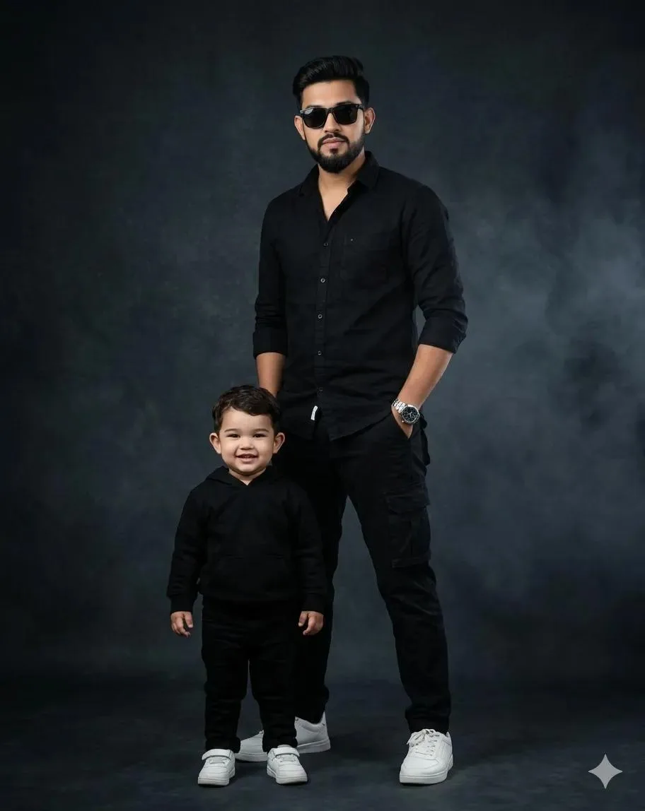 Include a small child standing slightly in front, also wearing a black hoodie, black pants, and white sneakers.