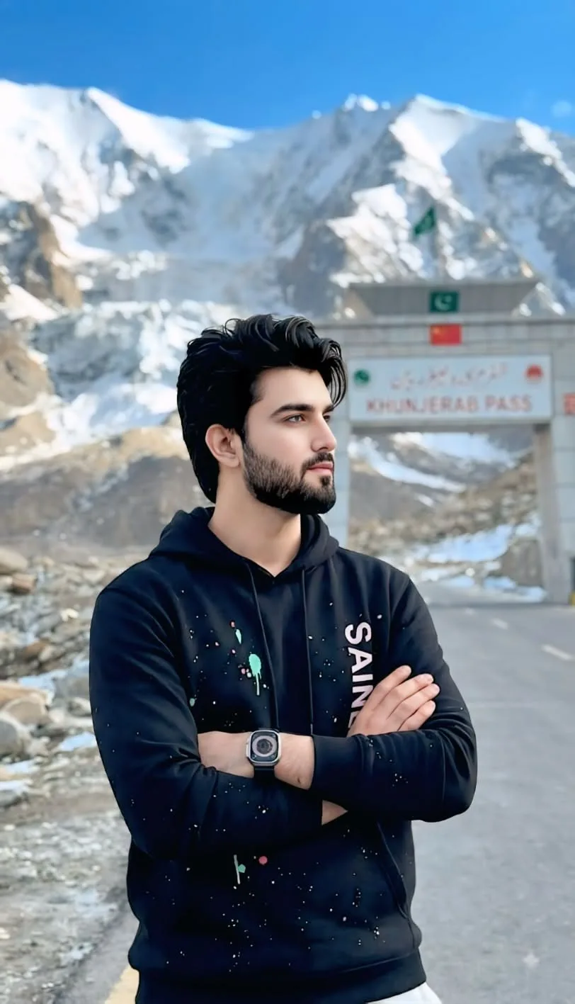 "A realistic 4k cinematic portrait of a handsome 24-year-old South Asian man with a well-groomed beard and stylish, voluminous black hair.