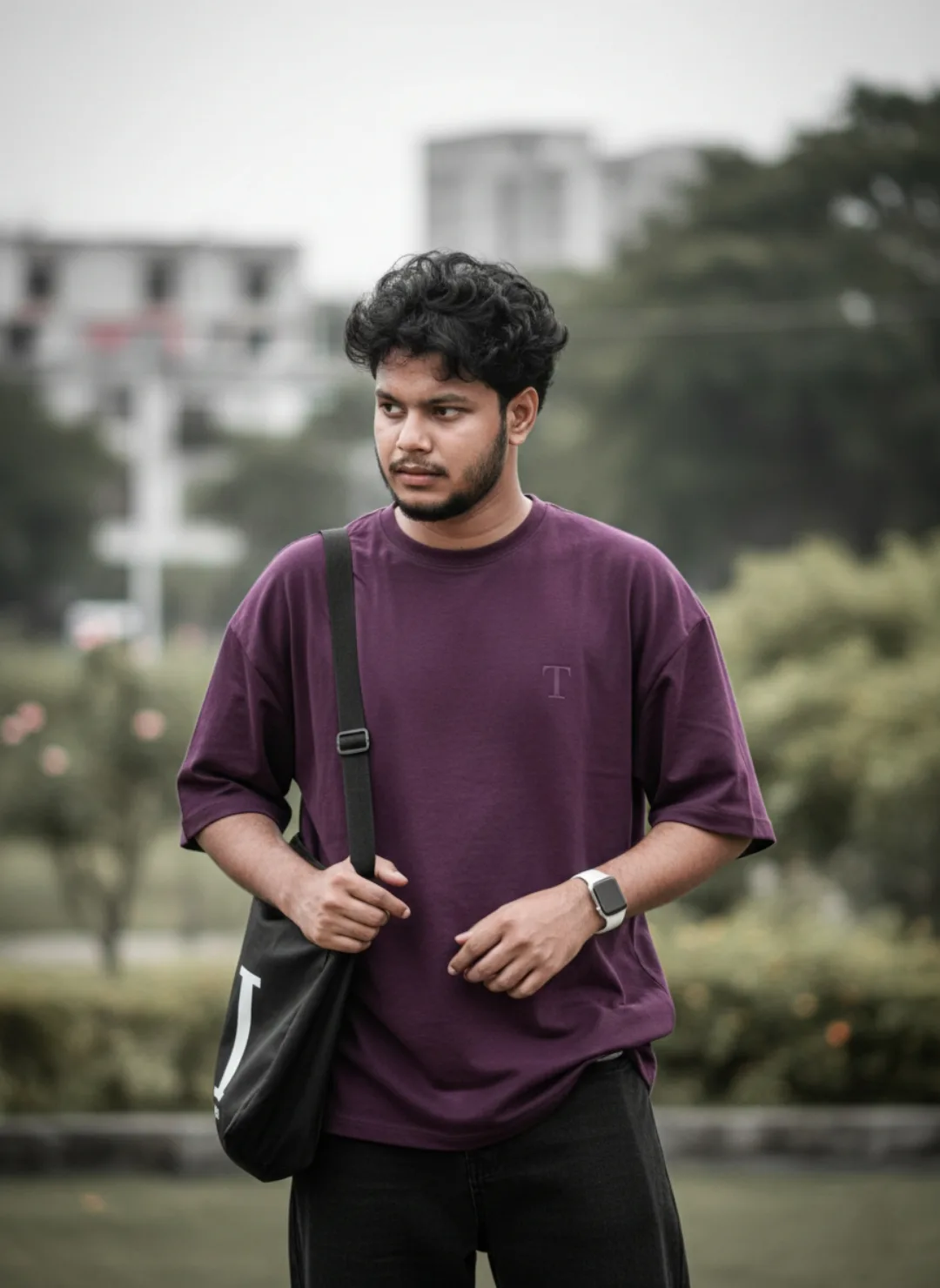A Subject: A 26-year-old Indian man, height 5 feet 5 inches, with a medium-fair skin tone, a well-defined stubble beard, and thick, curly