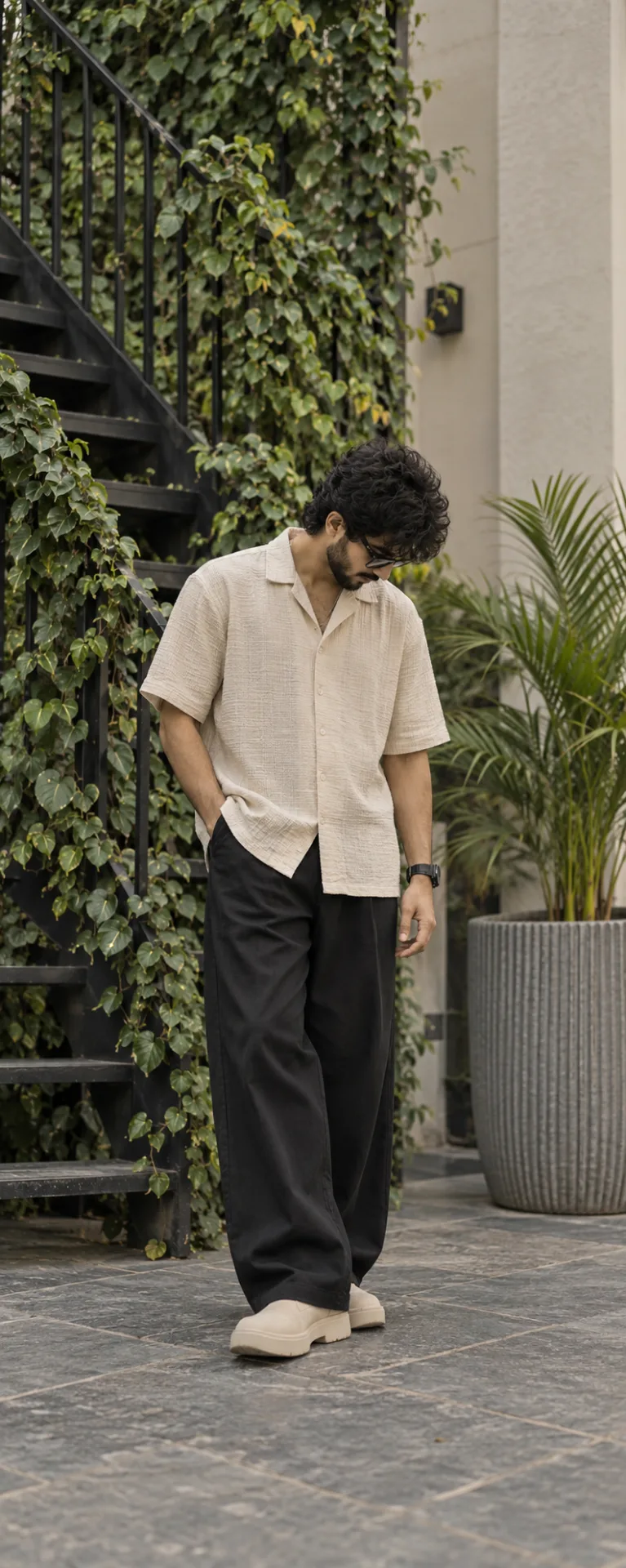 { "category": "portrait_creator", "category_reasoning": "The image features a single subject in a casual, styled outdoor environment
