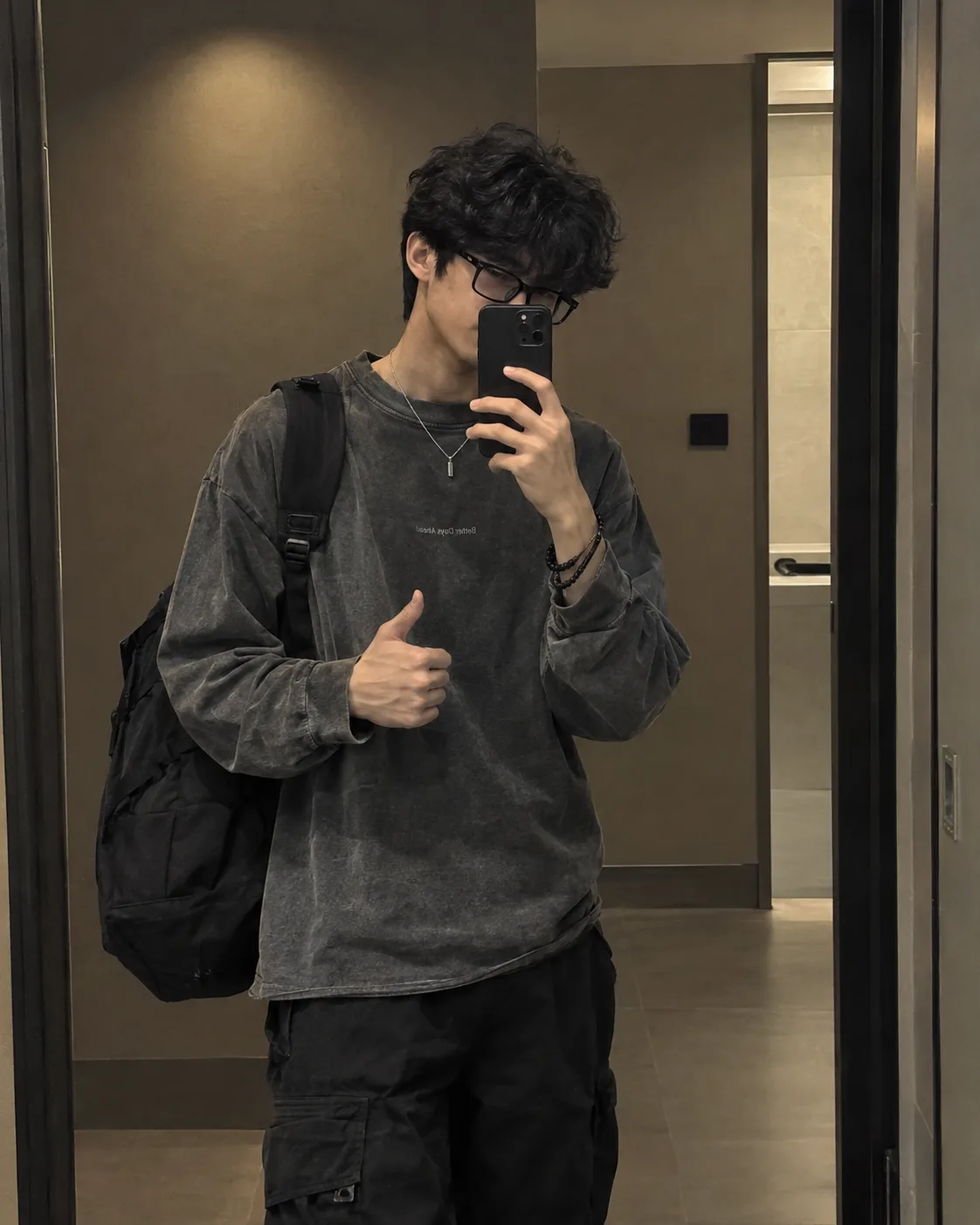 Create an ultra-realistic, premium streetwear mirror-selfie portrait of a young male in a modern minimalist interior.