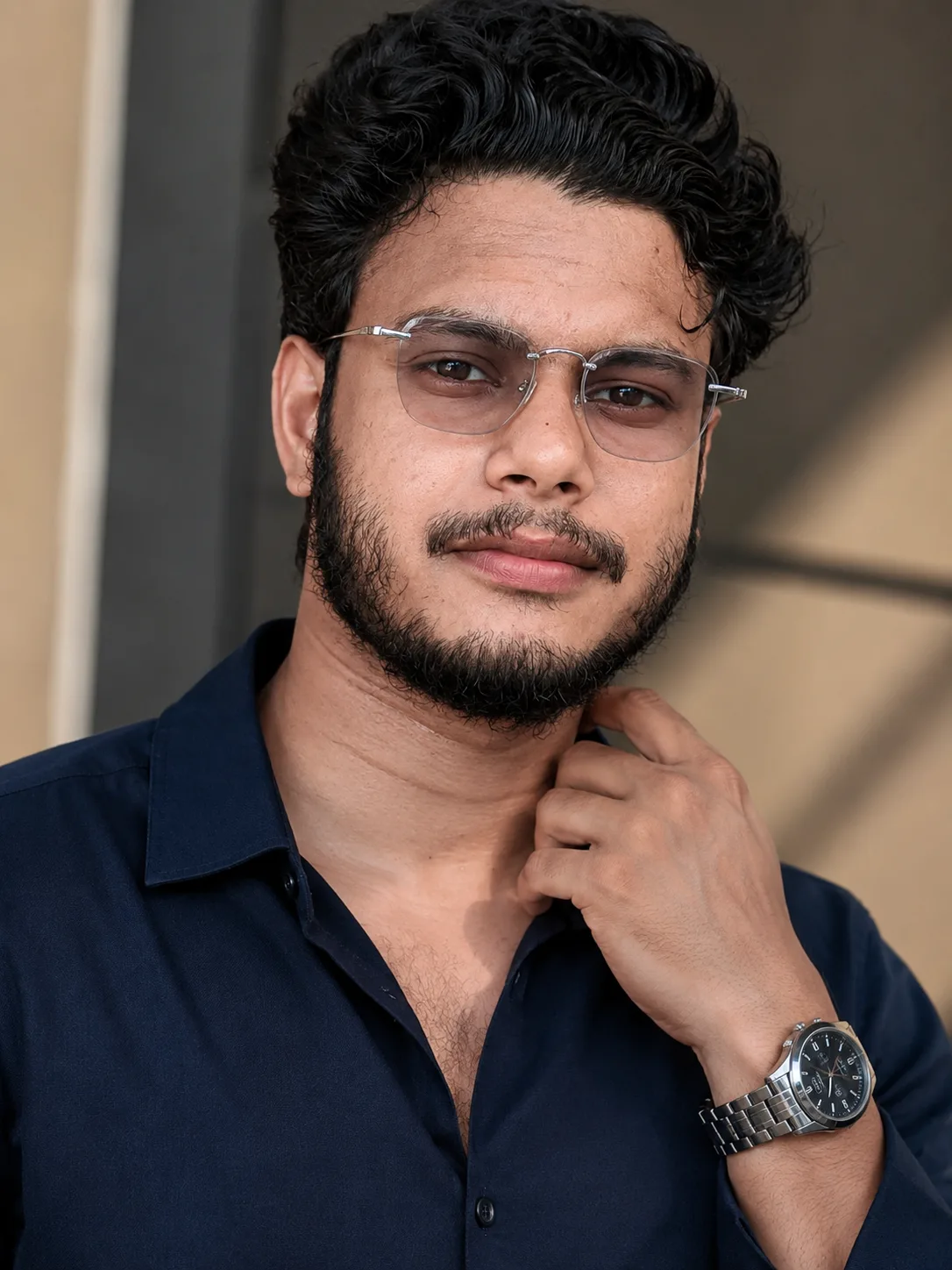 Without chaging face features, create a stylish, modern portrait of a young man with voluminousdarkhair wearing a loose-fitting Navy Blue