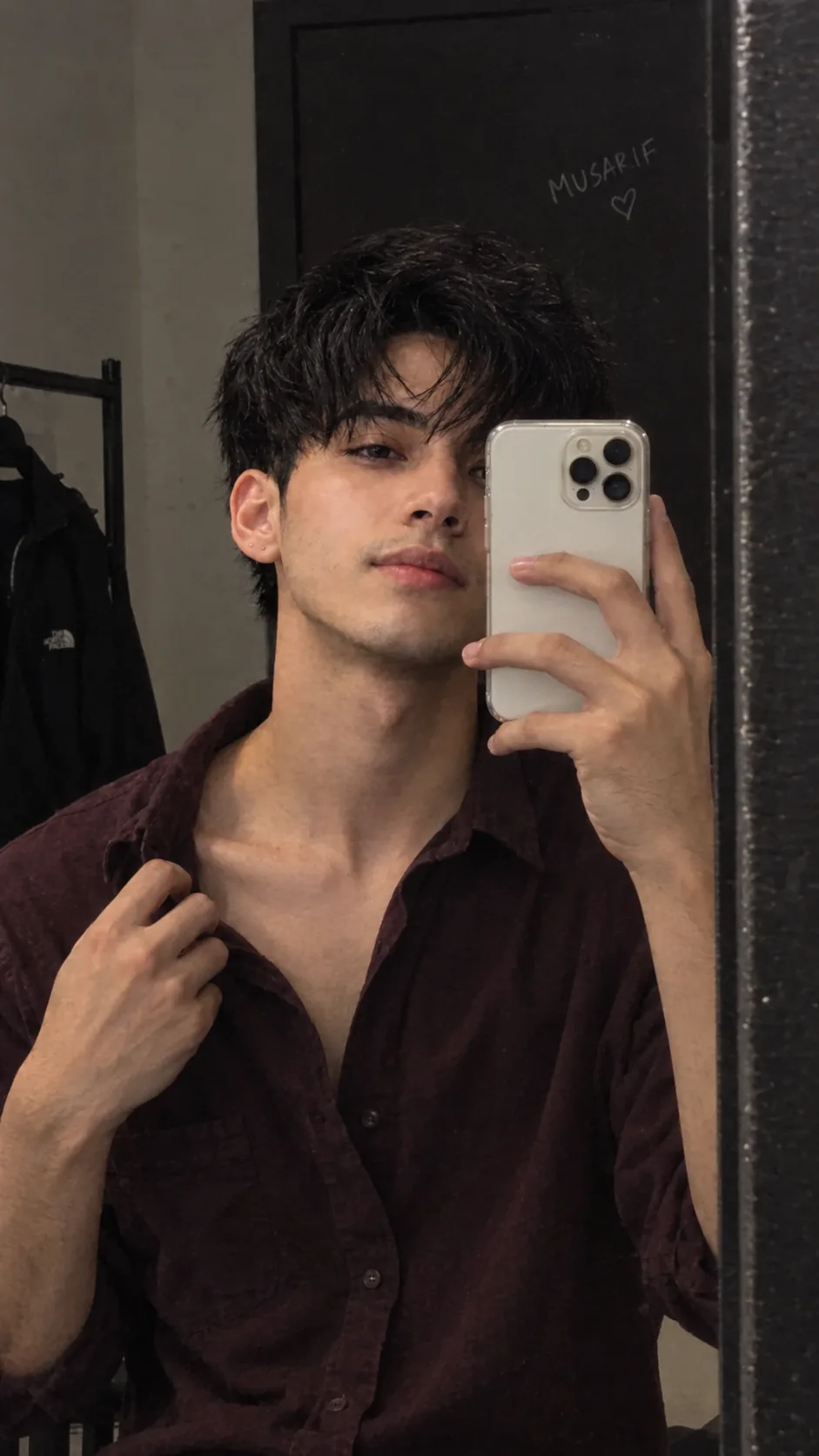 Create a highly photorealistic mirror selfie of a young South Asian man (early 20s).