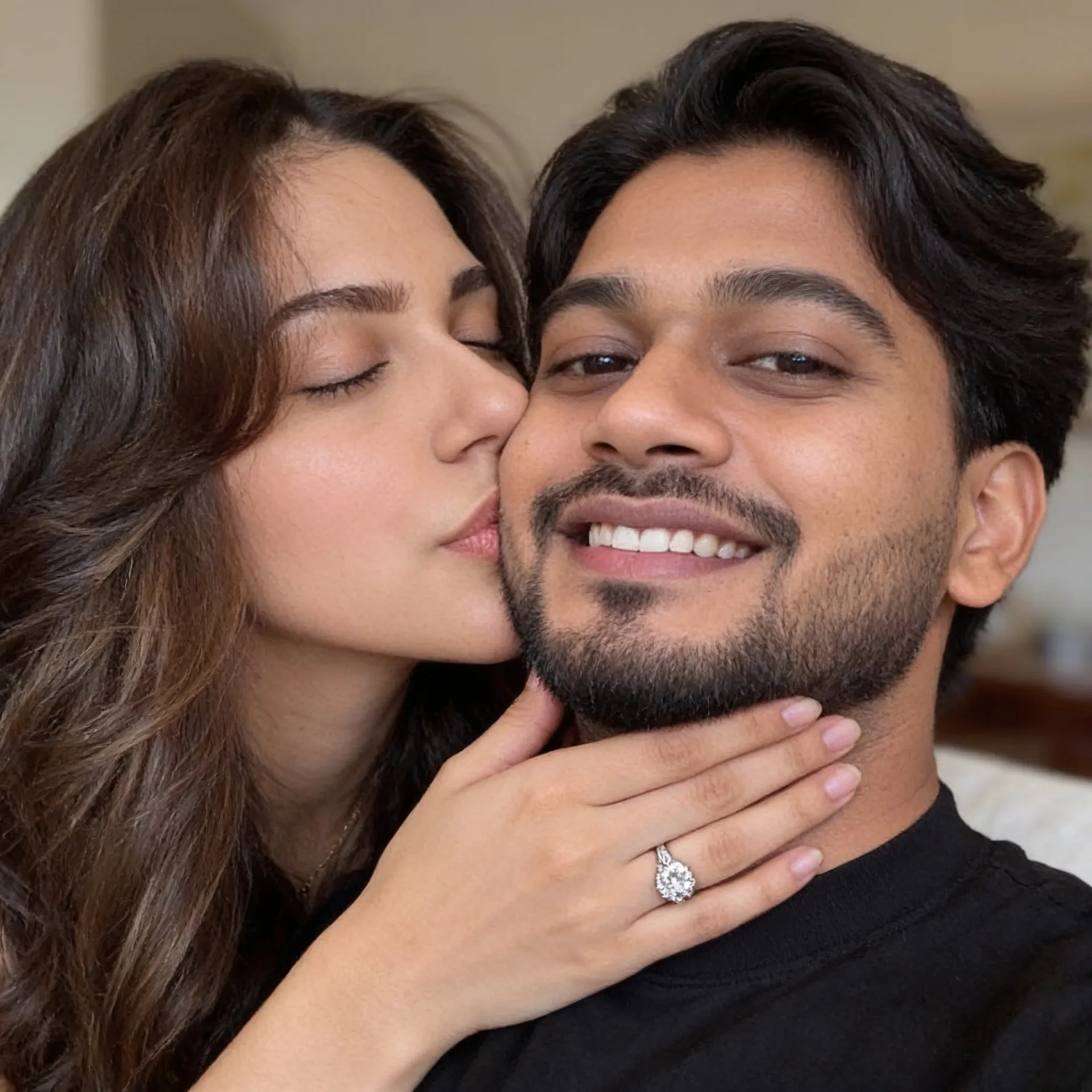 Prompt: An cute, candid close-up selfie photograph of a loving South Asian couple.