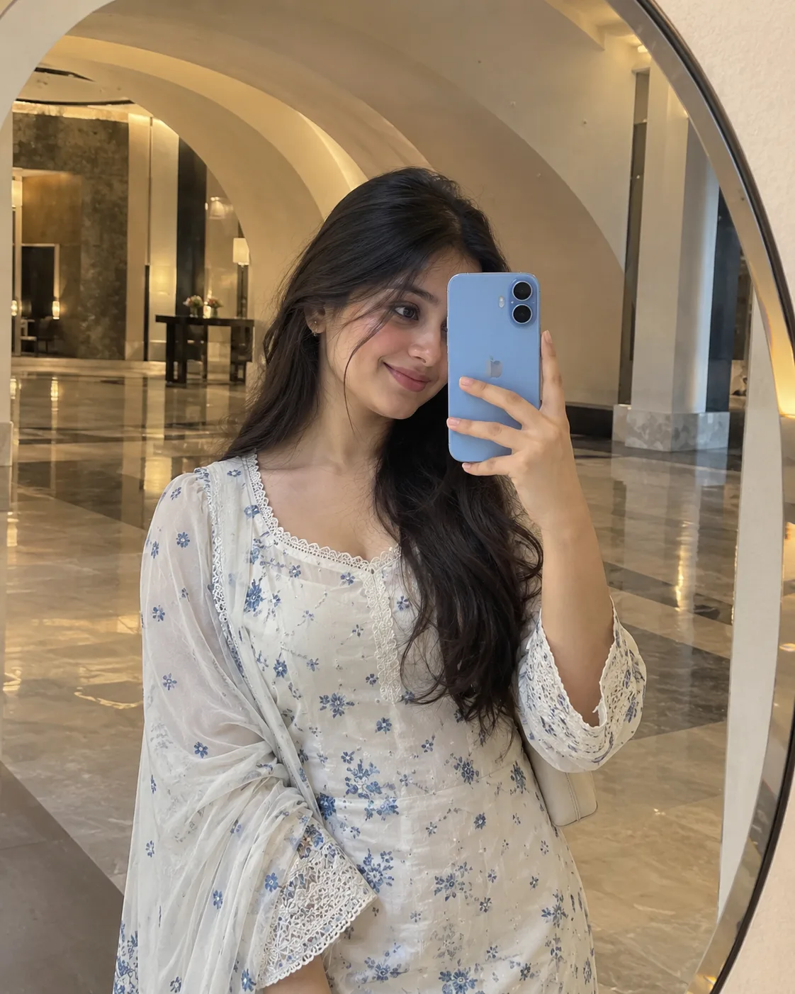 📸 Exact Image Generation Prompt > Create an ultra-realistic cinematic mirror selfie portrait of a beautiful young adult South Asian woman,