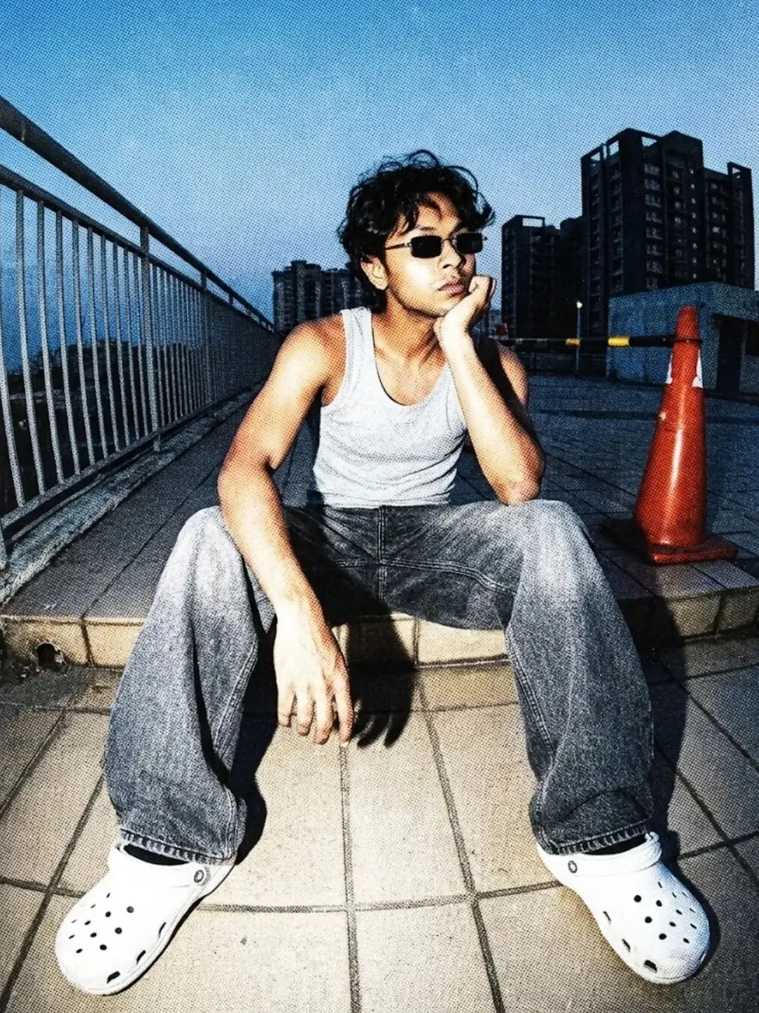 Retro 1990s streetwear magazine cover featuring a person [subject: use my reference photo for face and body He has messy dark wavy hair and
