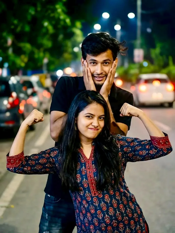 A photorealistic vertical medium shot in exact 3:4 aspect ratio capturing the young South Asian couple from the reference image outdoors on