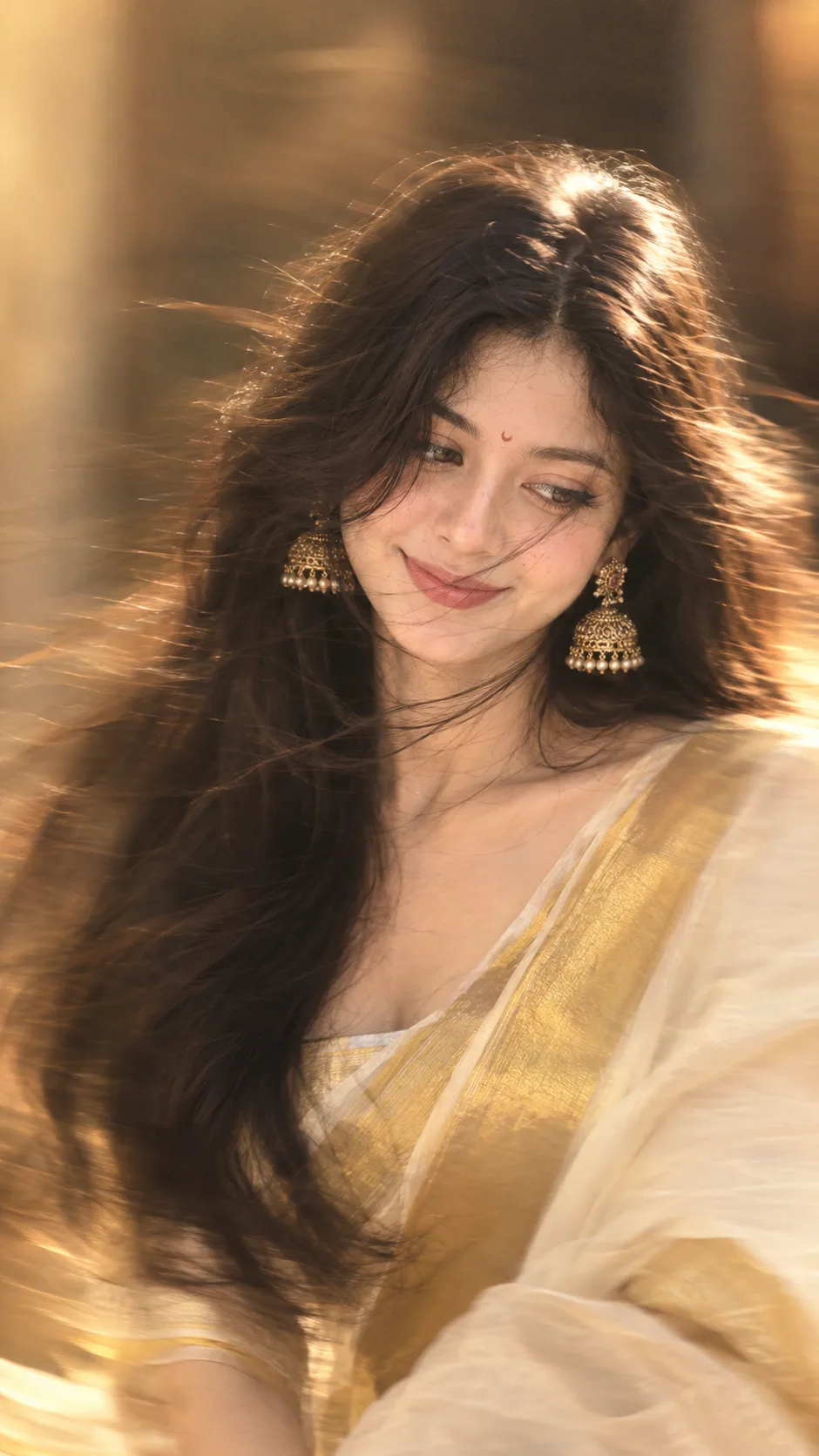 Create an intentional artistic motion blur ultra-realistic, dreamy editorial portrait of a young South Indian woman in an elegant Onam