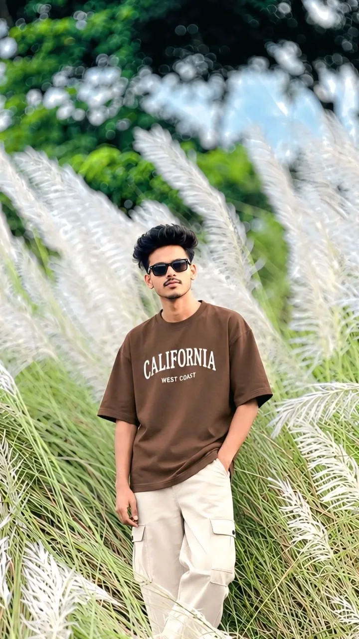 A photorealistic vertical medium-three-quarter portrait in exact 9:16 aspect ratio capturing the young South Asian man from the reference