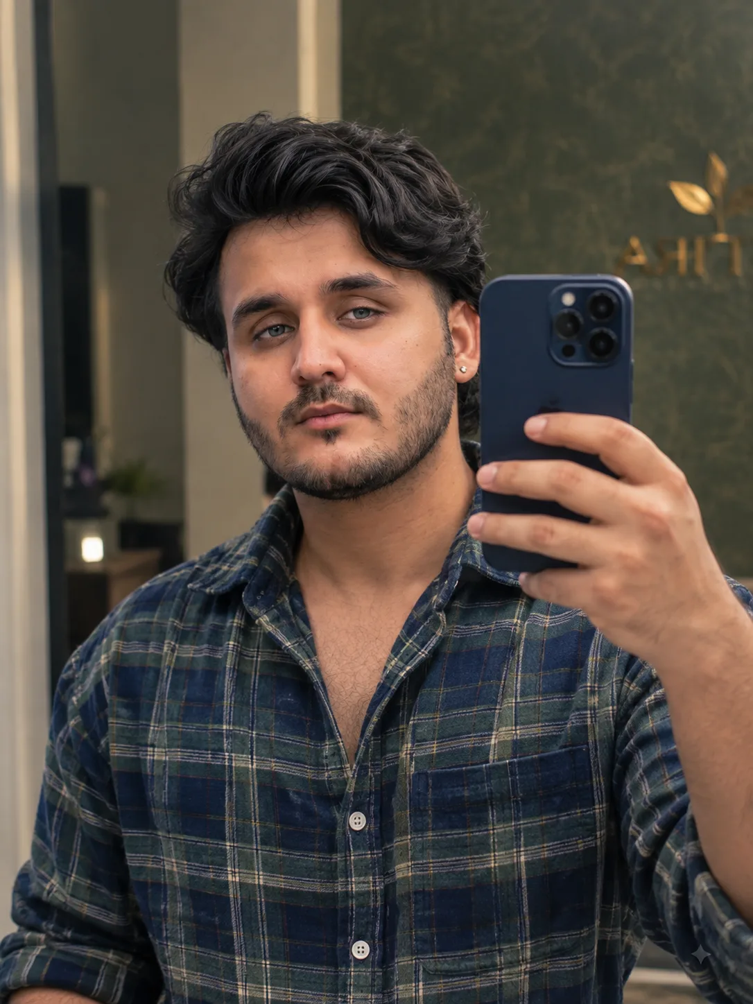 A photorealistic mirror selfie of a handsome young man with light olive skin, striking light grey-blue eyes, and thick, voluminous dark