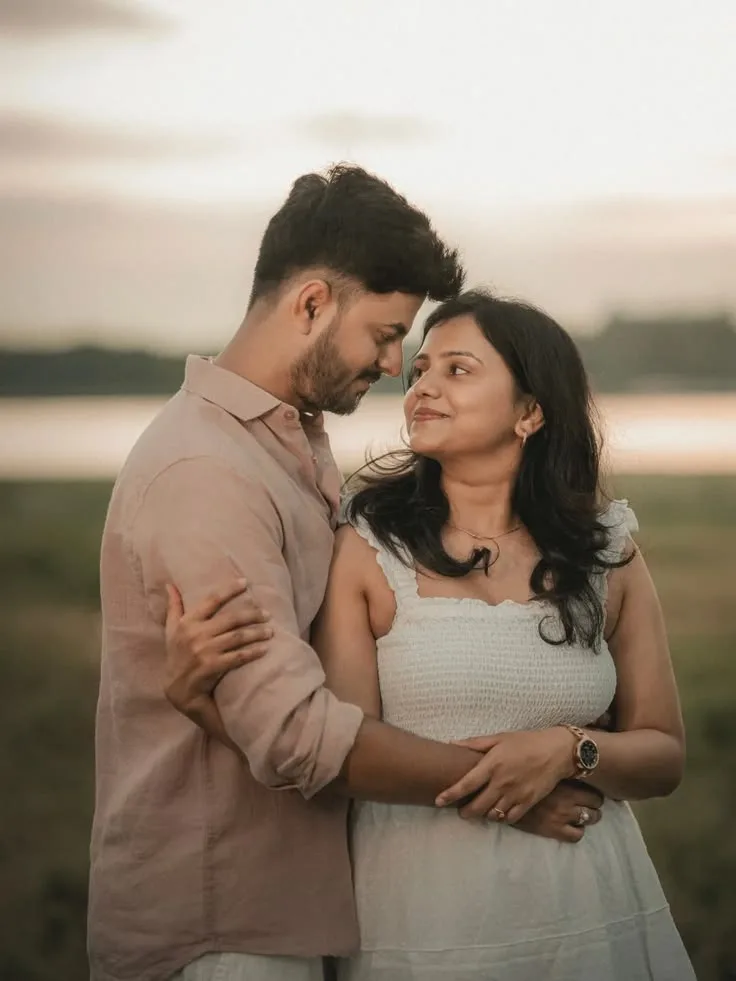 A photorealistic vertical medium shot in 3:4 aspect ratio capturing the young South Asian couple from the reference image, embracing