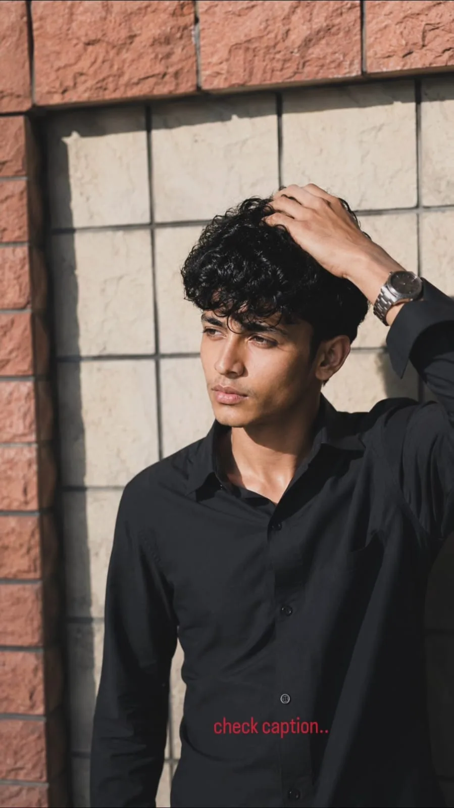 Create an ultra-realistic, cinematic vertical 9:16 DSLR-quality photograph of a young South Asian man, closely recreating the uploaded