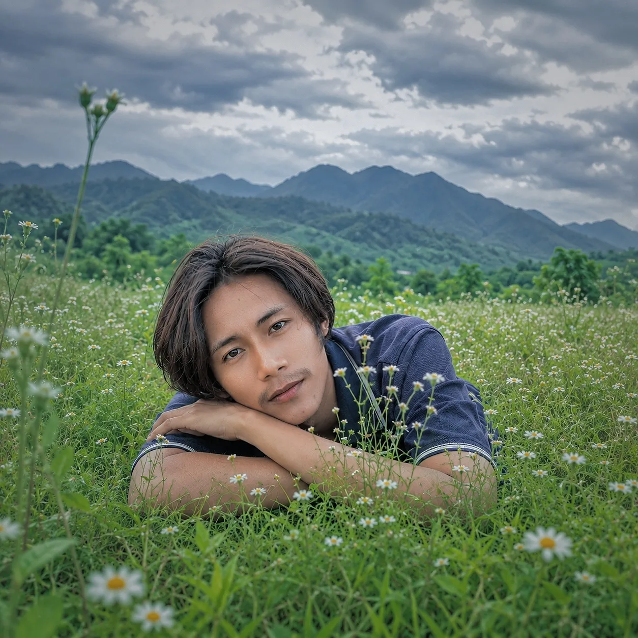 Create a highly realistic, premium outdoor nature photograph using the uploaded person’s photo as the EXACT facial identity reference.