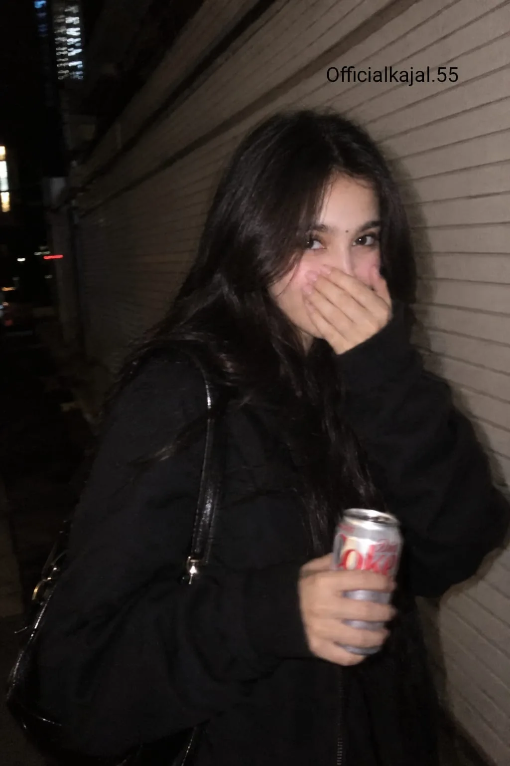 PROMPT: A realistic aesthetic candid nighttime street photo of a beautiful young woman laughing and covering her mouth with her hand.
