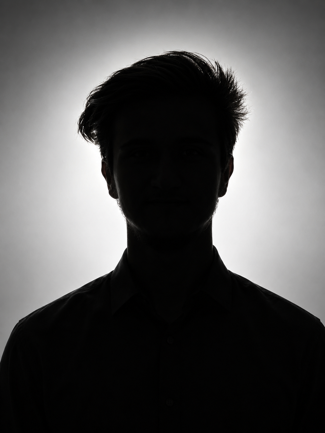 Front-facing portrait of the person from the reference photo, shown from the chest up with a relaxed but upright posture, slightly tilted
