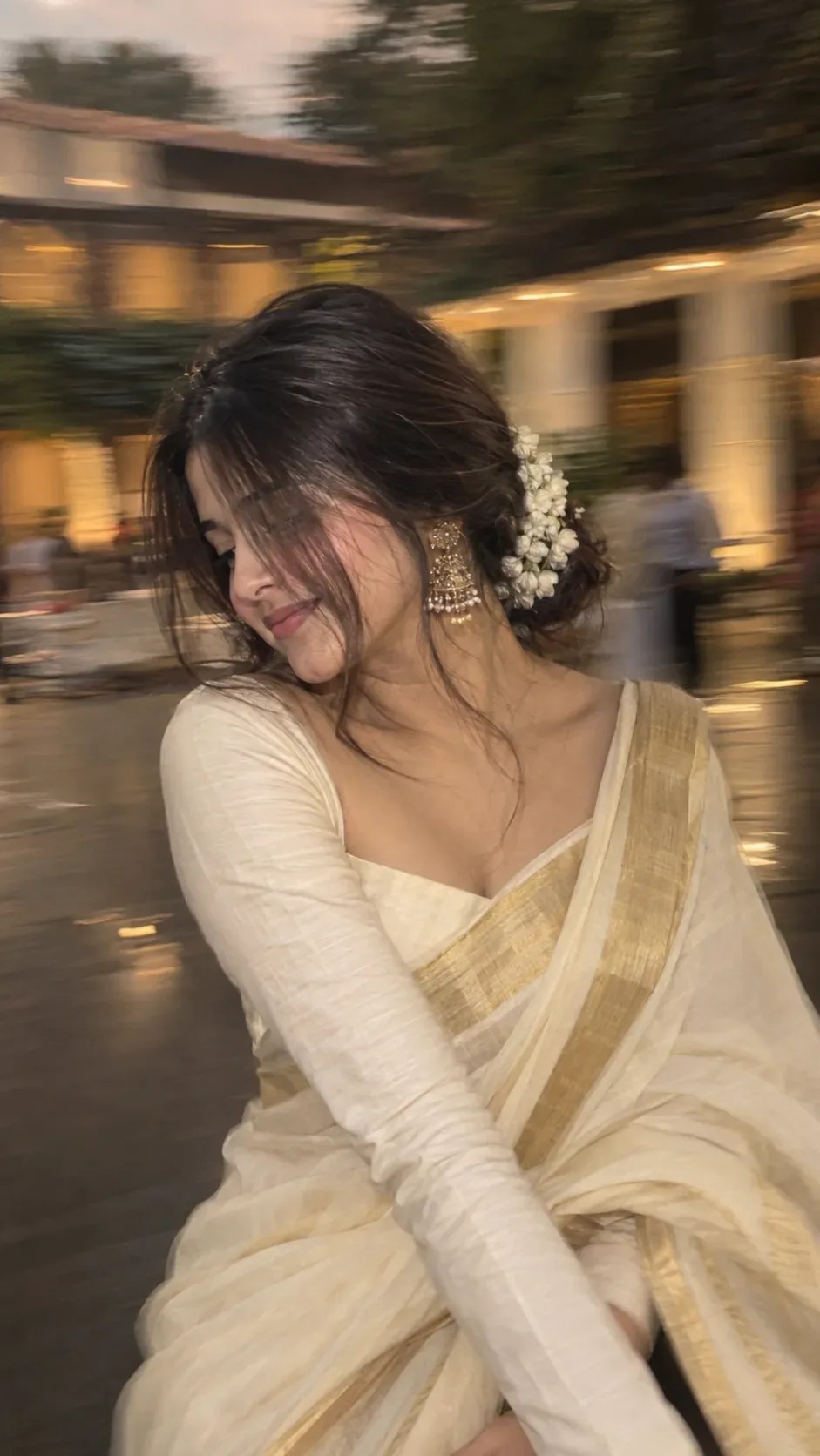 Without changing original face create an Intentional artistic motion-blur portrait, shot on a smartphone or long-exposure camera.