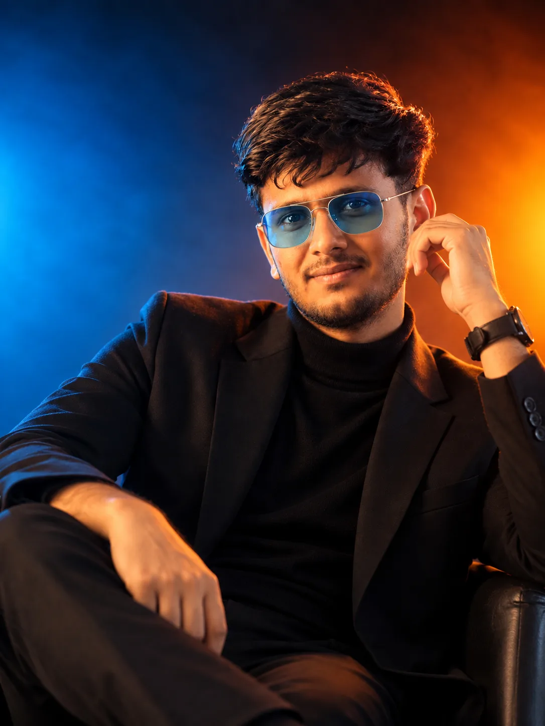 Create an ultra-realistic cinematic fashion portrait of the same young South Asian man from the provided reference photo.
