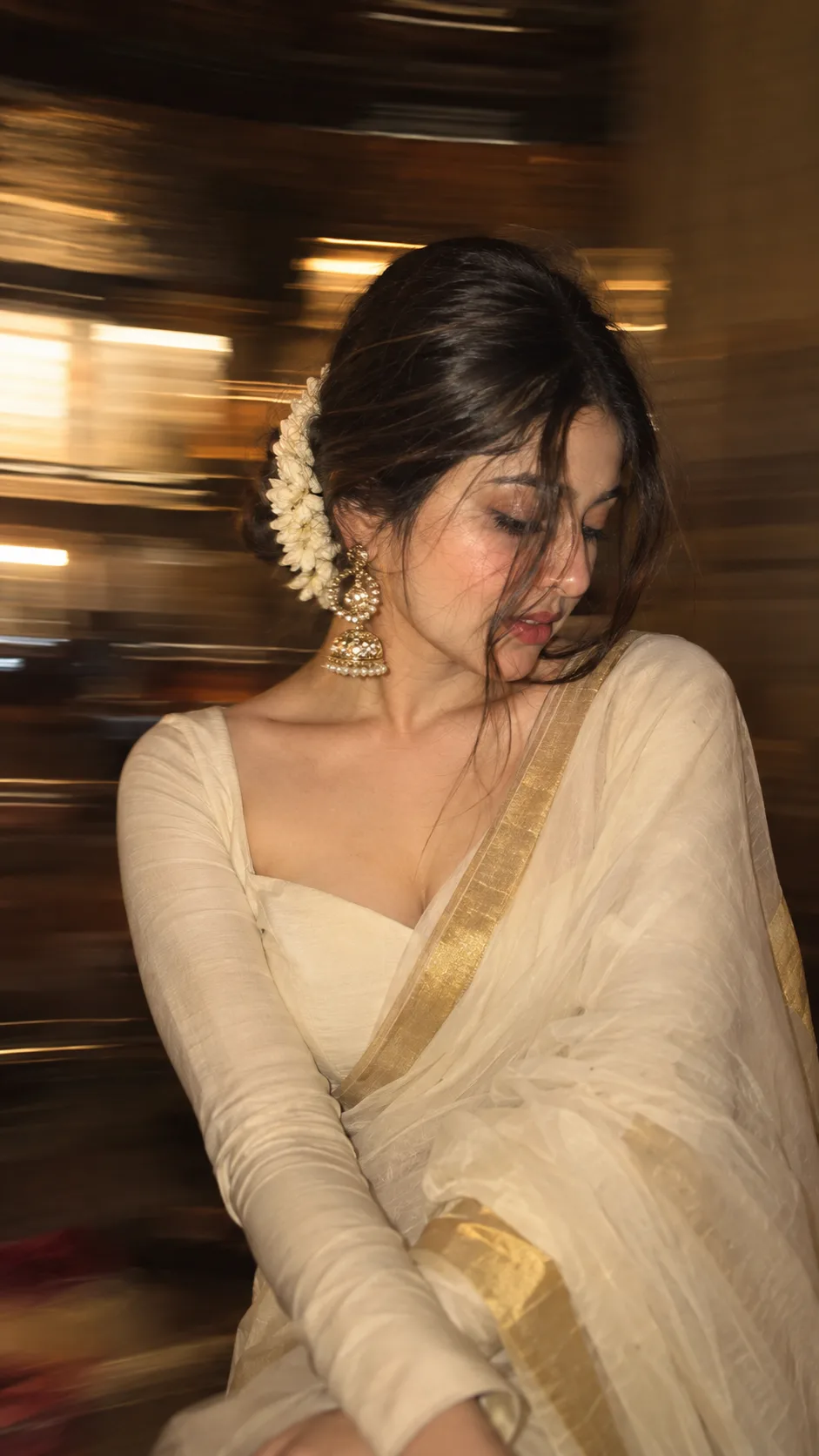Without changing original face create an Intentional artistic motion-blur portrait, shot on a smartphone or long-exposure camera.