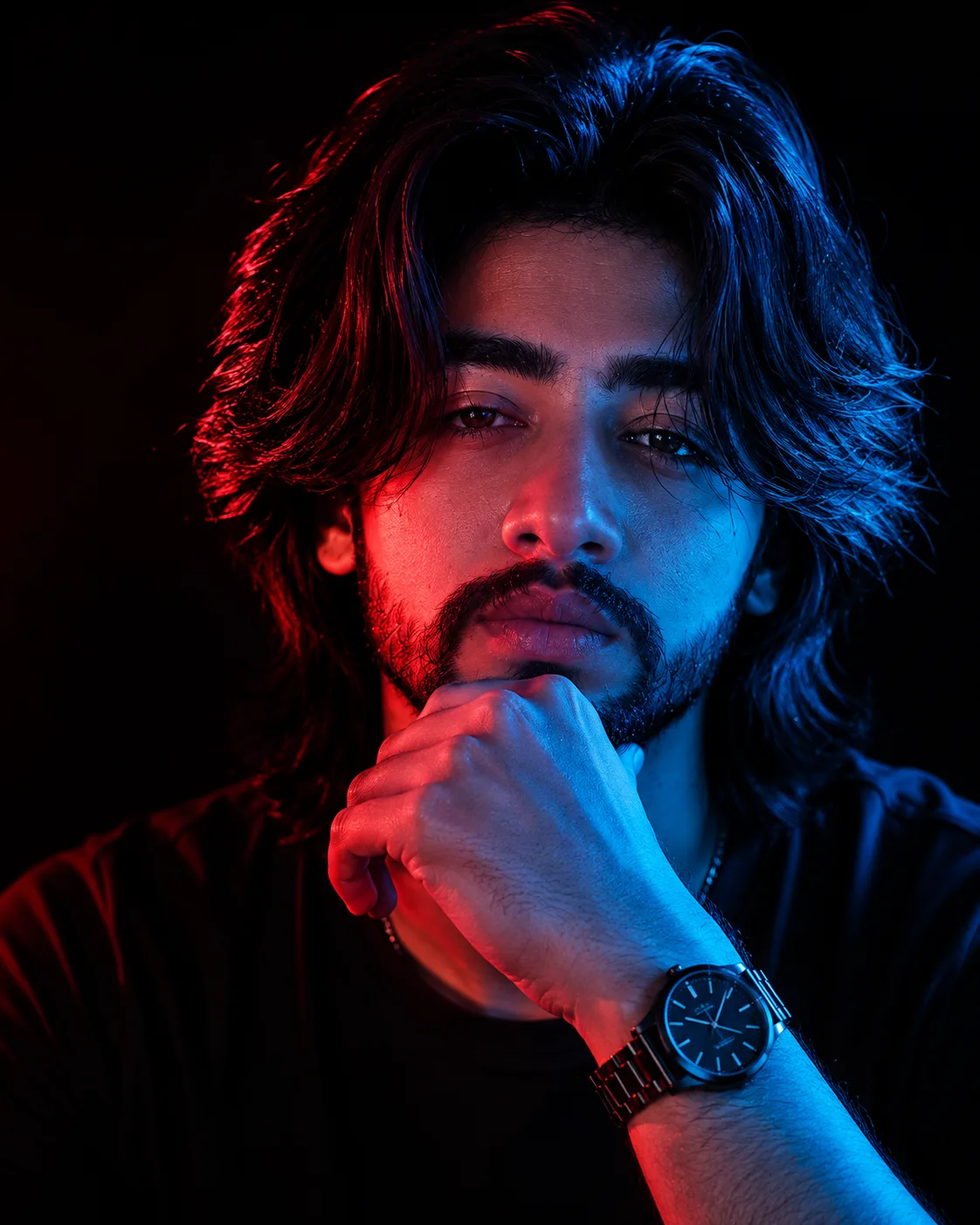 "A dramatic close-up studio portrait, precisely replicating the hand-on-chin contemplative pose and exact lighting pattern from
