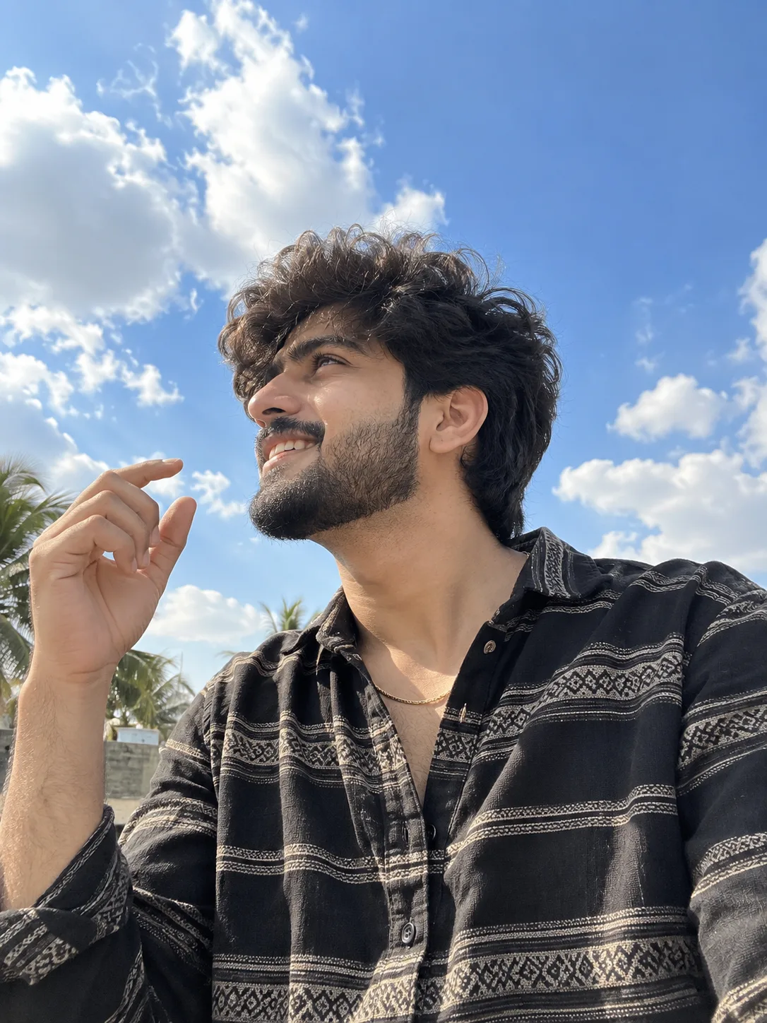Create an ultra-realistic outdoor smartphone portrait using my uploaded face as the identity reference.