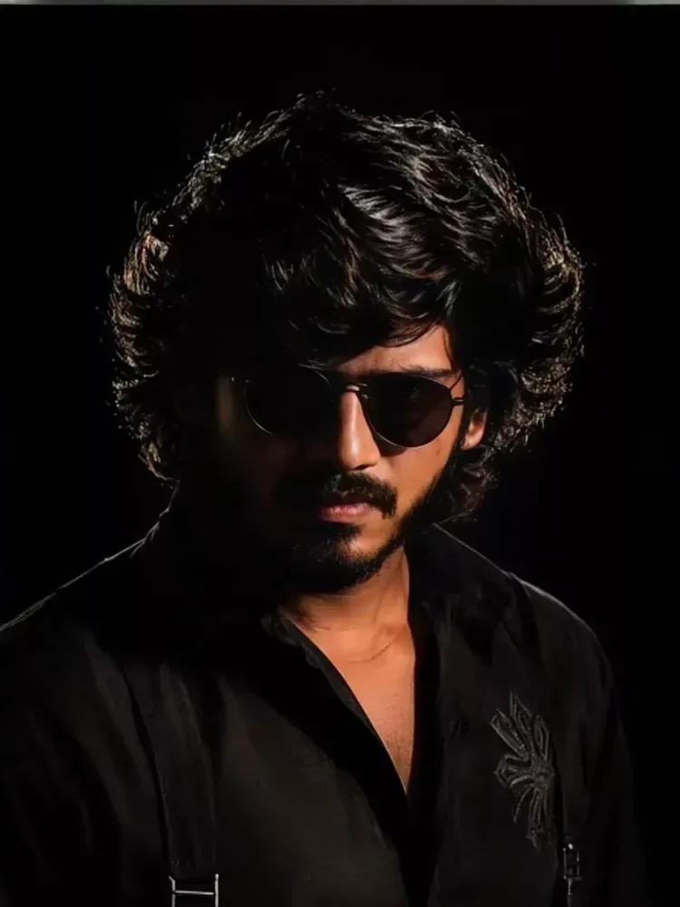Ultra-realistic cinematic studio portrait of a young Indian man, front-facing pose with head slightly tilted down, eyes looking downward,