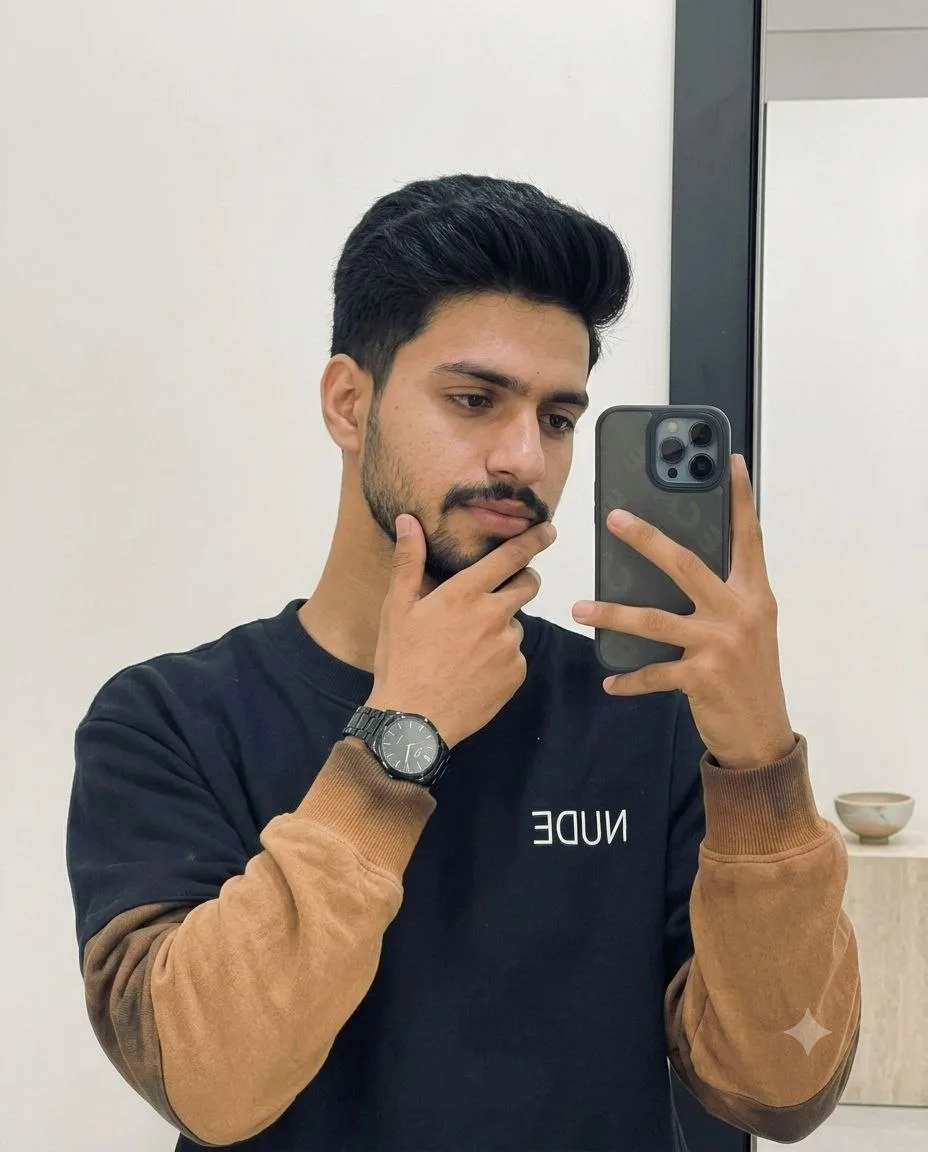 Transform the uploaded portrait into an ultra-realistic indoor mirror selfie while preserving the subject's facial identity, facial