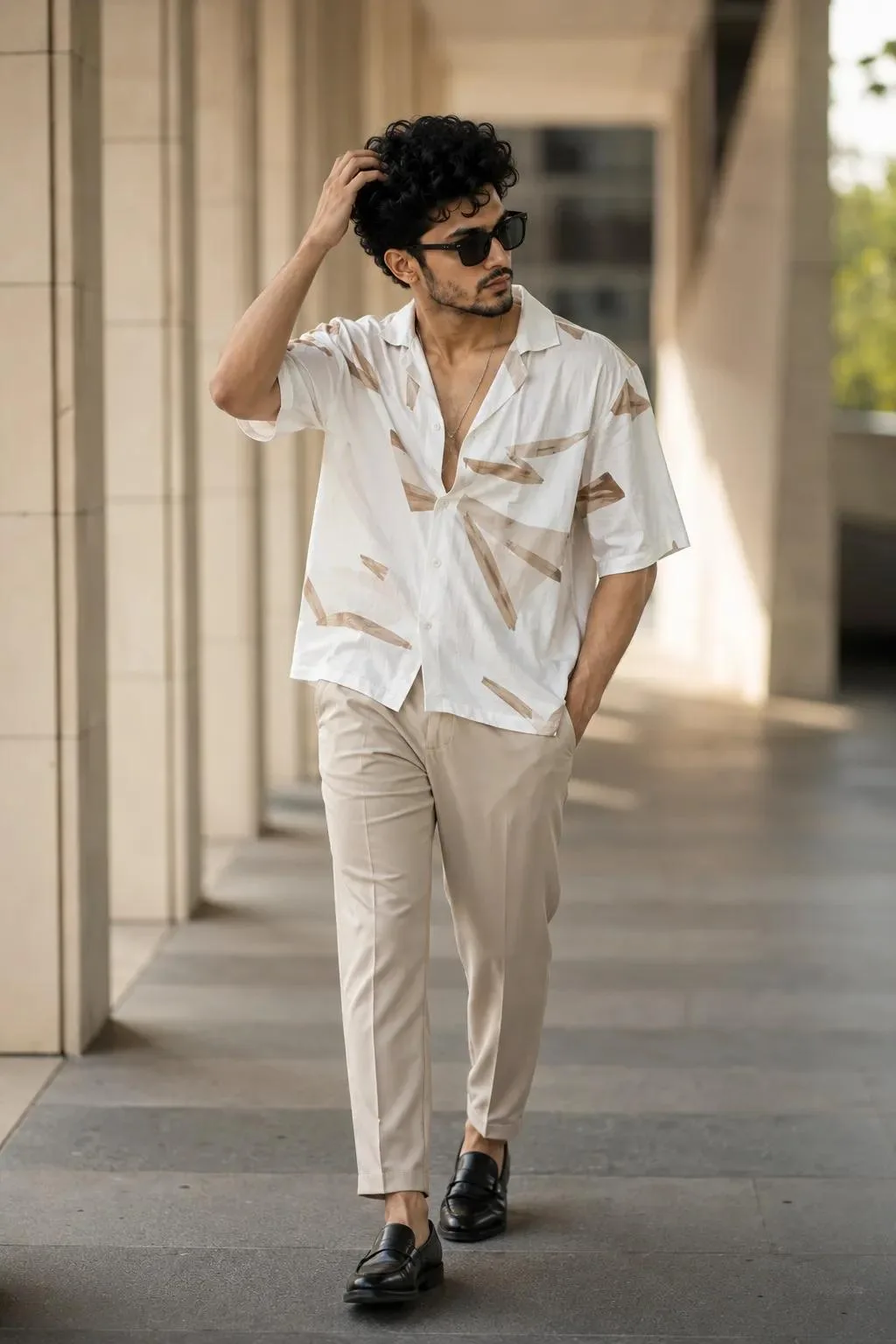 Ultra realistic cinematic full-body portrait of a stylish young man walking confidently in a modern outdoor corridor, soft natural