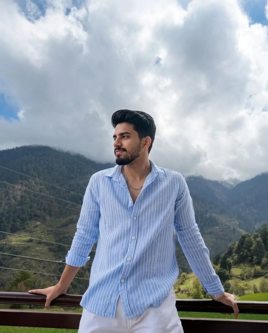 Transform my uploaded face into this exact ultra-realistic mountain travel portrait while preserving my facial identity, hairstyle,