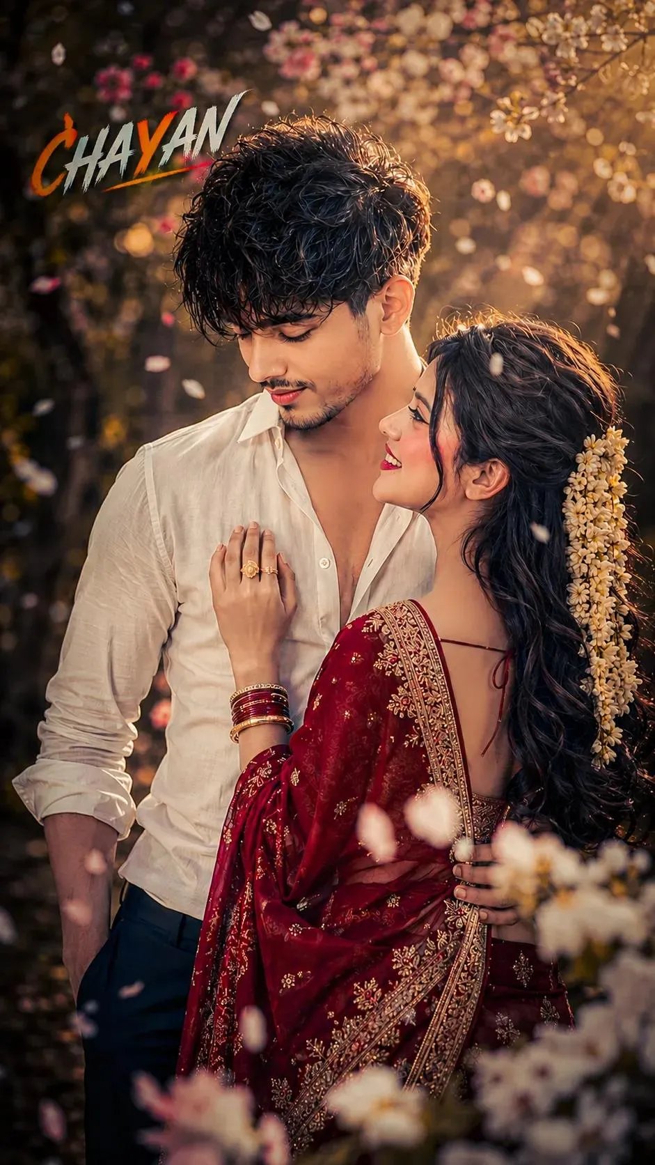 A cinematic, hyper-realistic medium shot of a romantic young Indian couple embracing amidst a flurry of falling cherry blossoms.