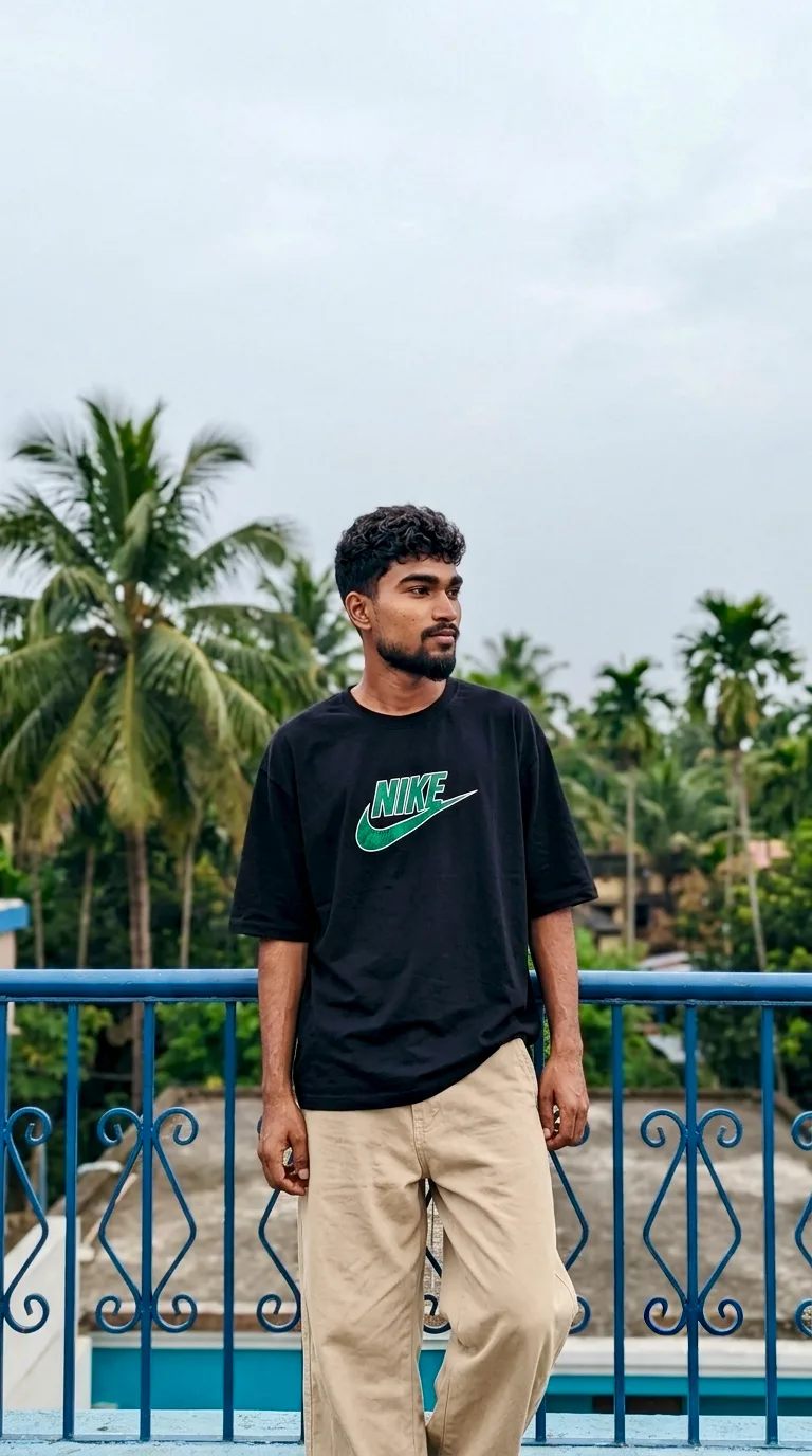 A photorealistic vertical full-length shot of the young South Asian man from the reference image, faithfully preserving his recognizable