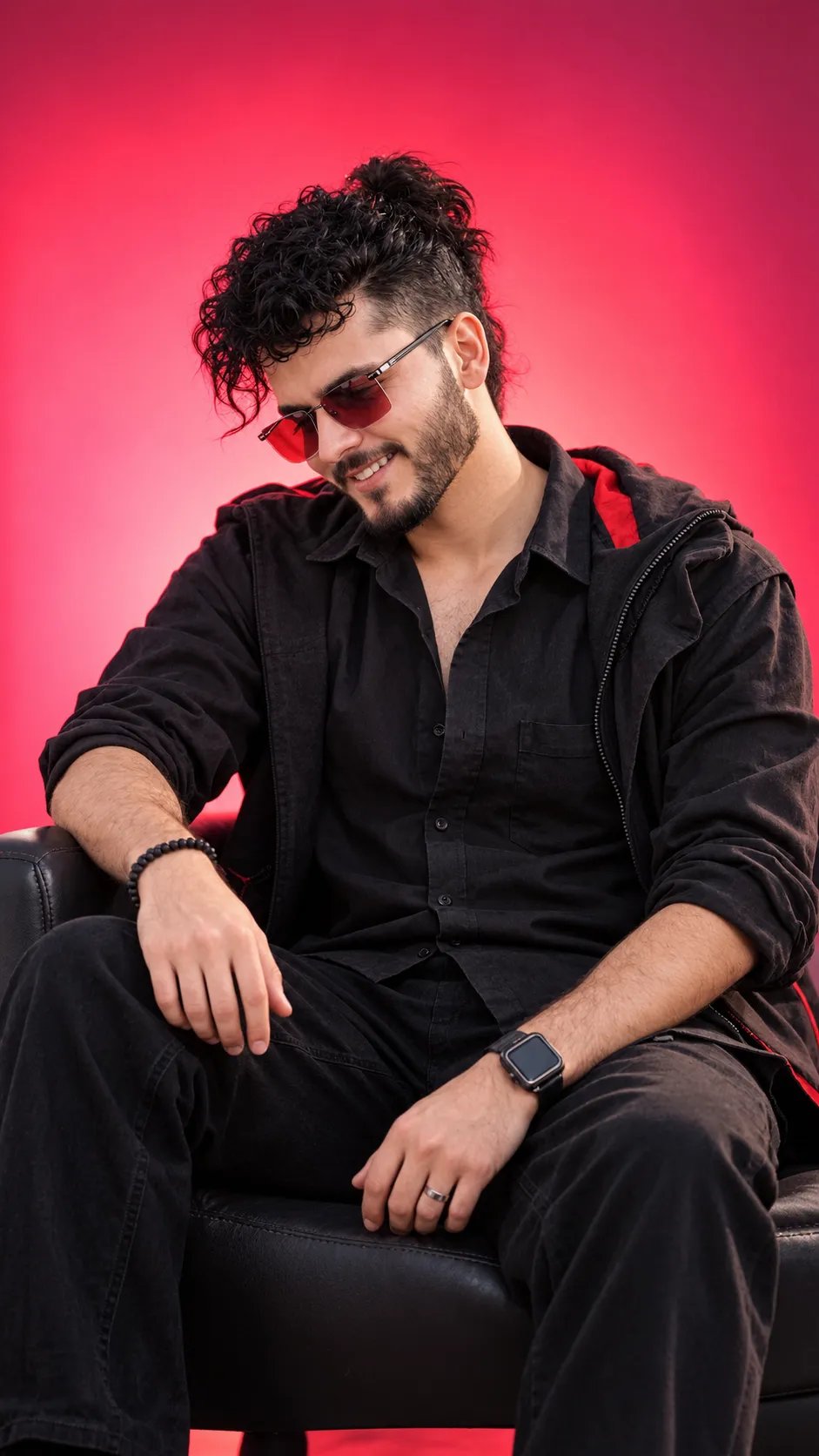 DARK THOUGHTS: THE CINEMATIC MOOD♥️♥️ @anand.sandilya2 A stylish man sitting in a chair against a brightpink-red gradient studio