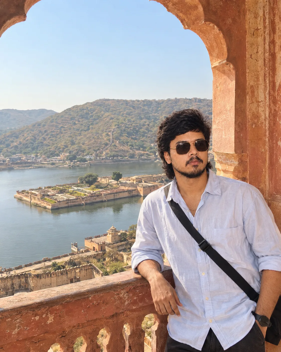 📸 Exact Image Generation Prompt Create an ultra-realistic cinematic travel portrait of a young adult South Asian man, closely inspired by
