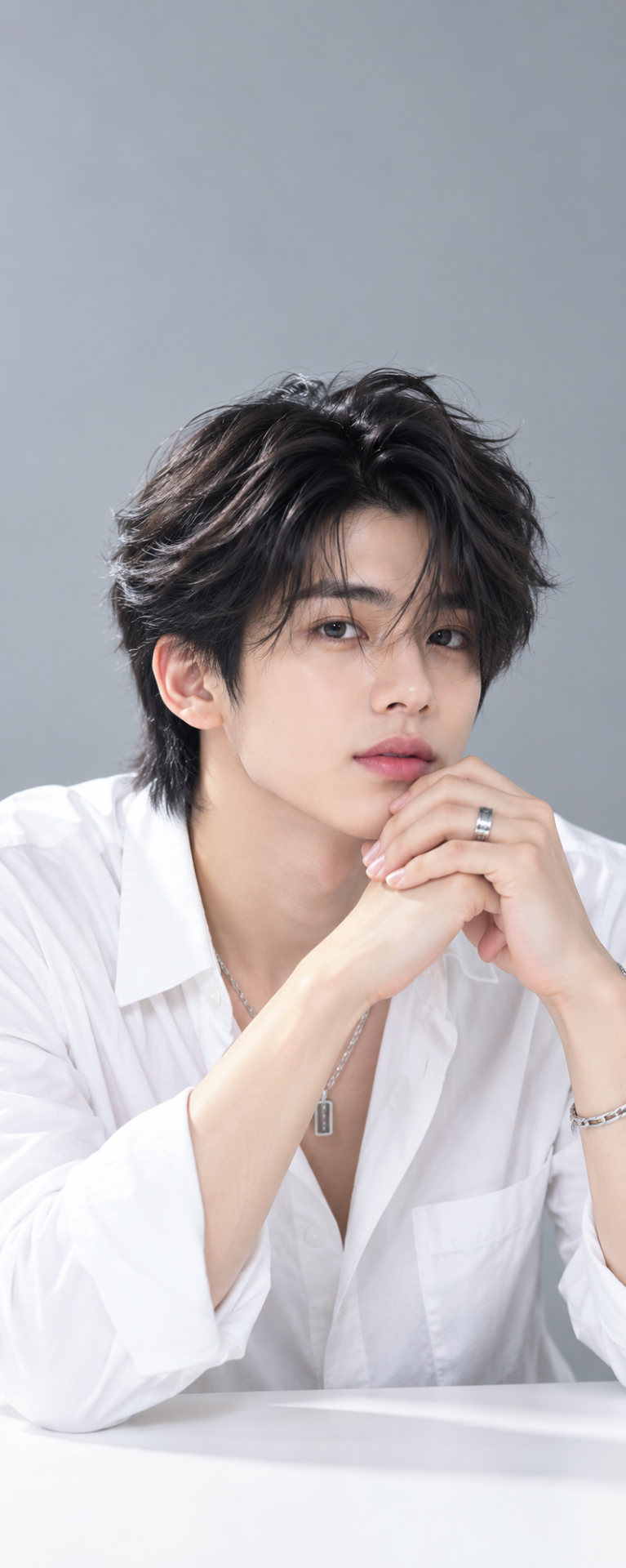 { "category": "fashion_editorial", "category_reasoning": "This is a studio portrait of a styled male model with professional lighting and