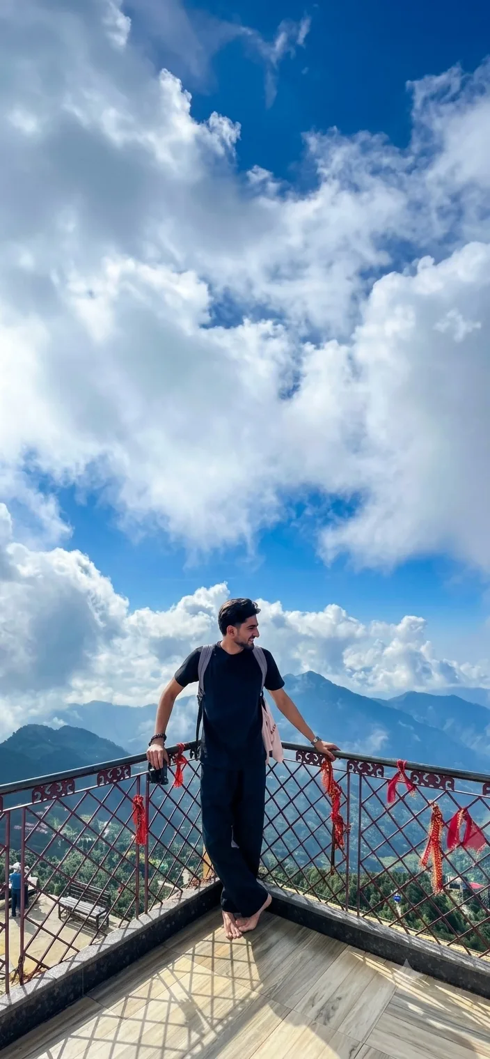 A photorealistic vertical full-length shot capturing the young South Asian man from the reference image standing barefoot on an outdoor