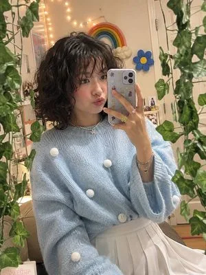 A photorealistic vertical mirror selfie of a {argument name="subject" default="young woman"} in a {argument name="setting" default="cozy,