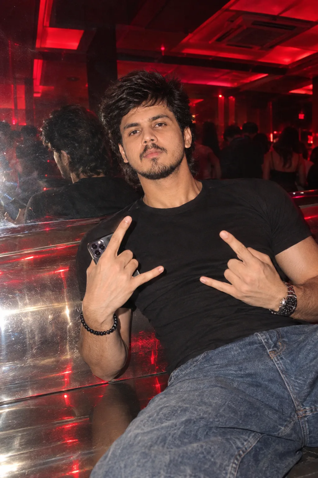Ultra realistic close-up flash photo of ^ a young man (based on reference photo) in a dark nightclub, his body leaning diagonally to the