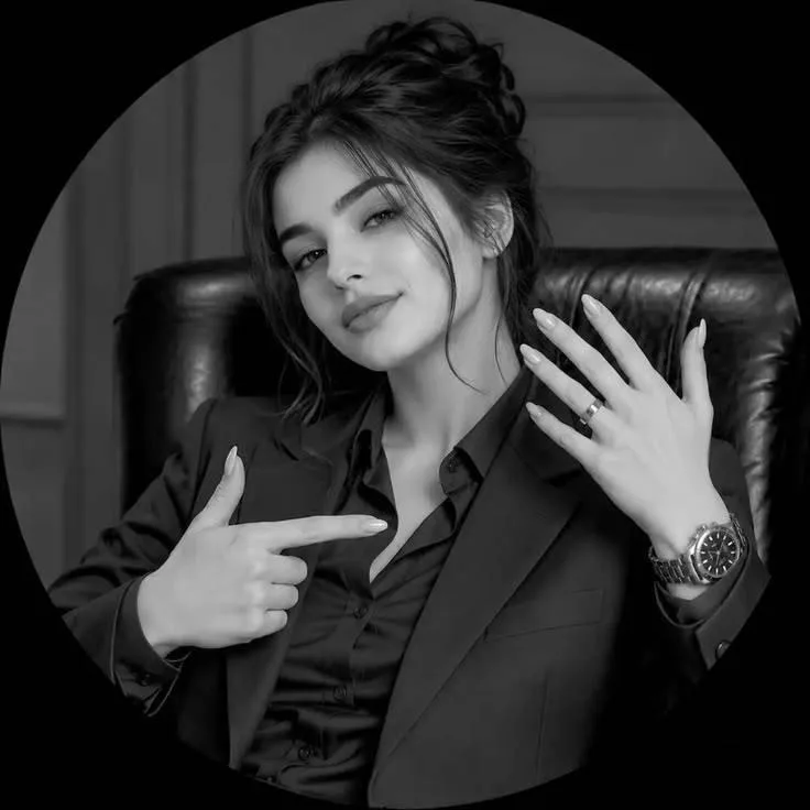 A high-end black and white studio portrait of a confident and beautiful young woman acting like a CEO.