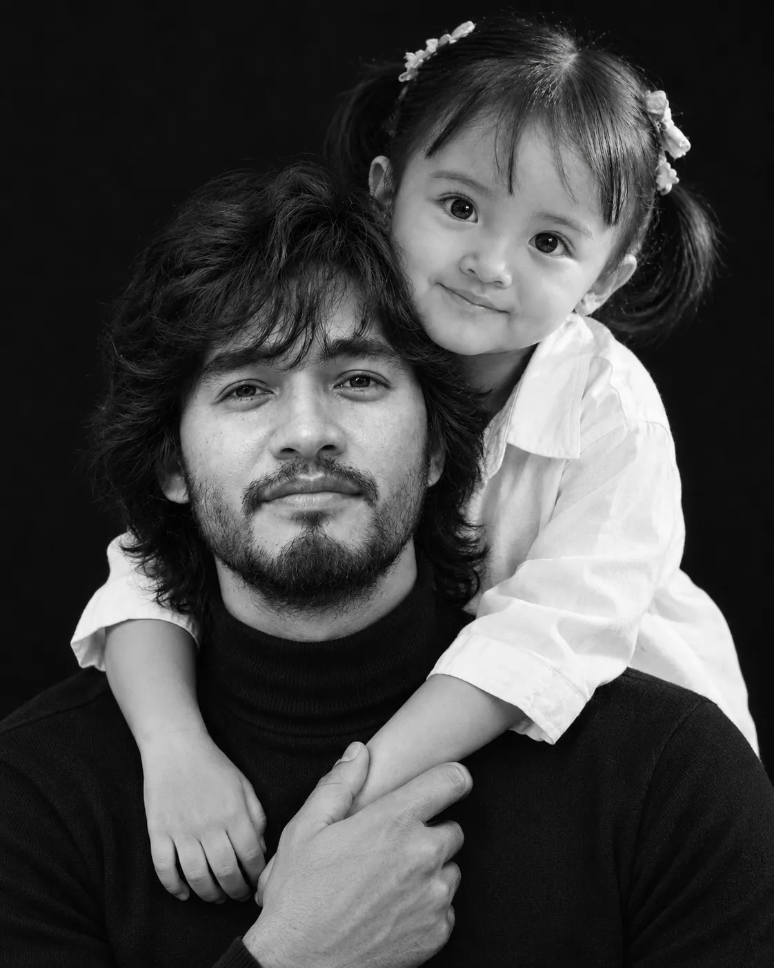 Use the provided reference photos as the primary identity reference for the father and child.