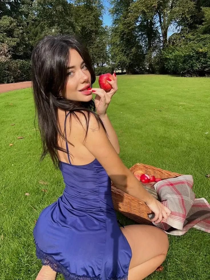 Sunny Park Lawn Picnic Portrait of Young Woman with Red Apple
