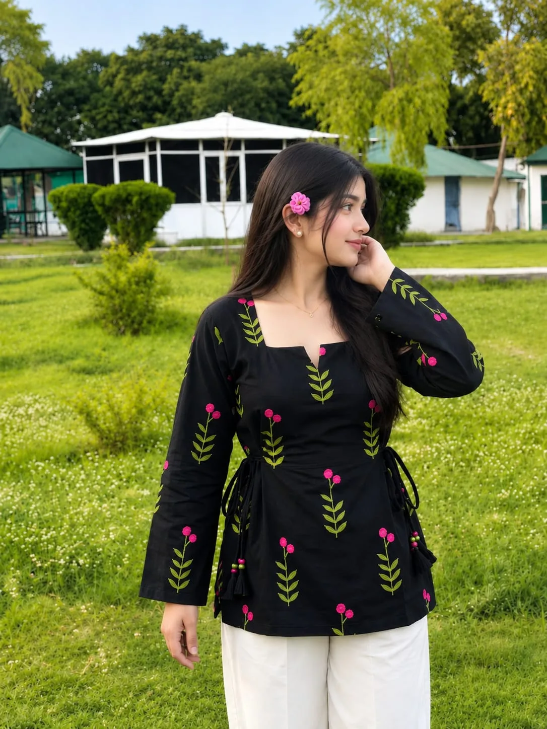 Create an ultra-realistic, high-detail vertical 4:5 outdoor portrait of a young South Asian woman standing gracefully in a lush green