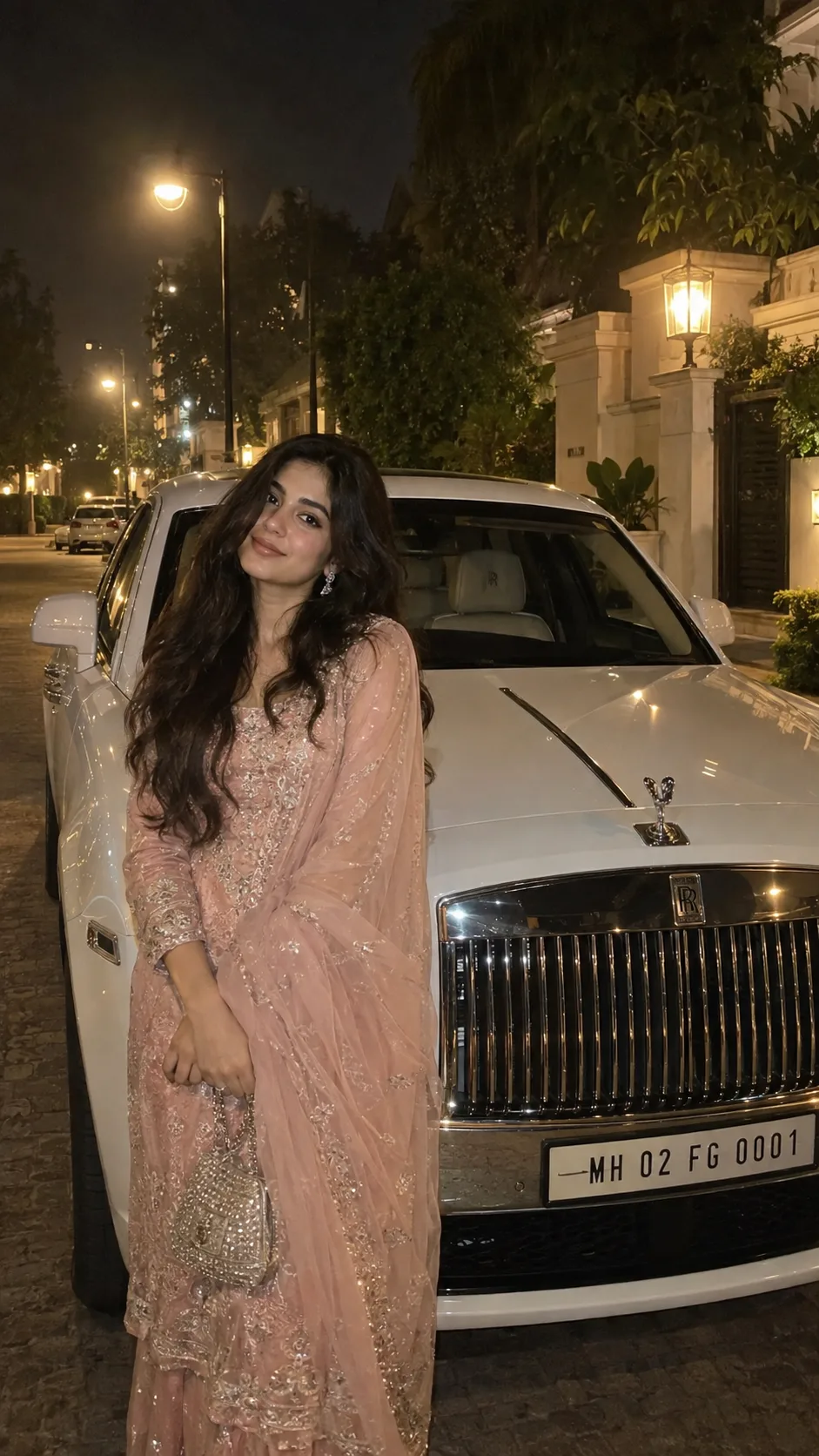 Ultra-realistic 9:16 nighttime smartphone photograph of a young South Asian woman in an elegant blush-pink embroidered traditional outfit,