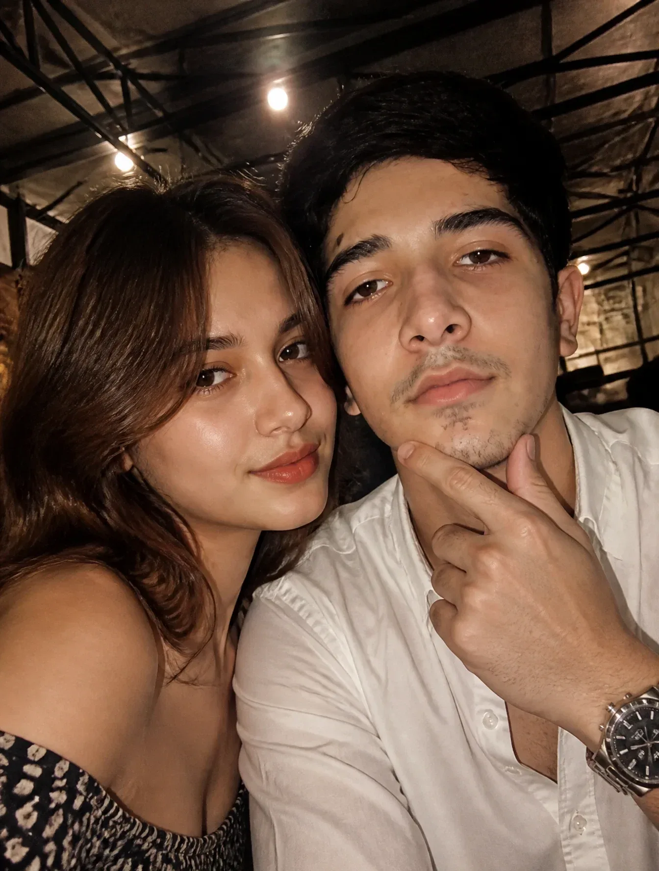 { "scene_type": "indoor close-up lifestyle selfie", "setting": { "location_type": "indoor public venue", "environment_style": "industrial