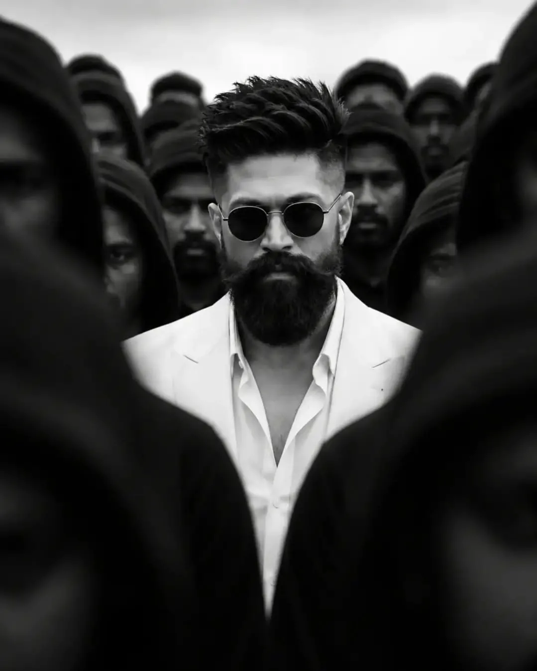 A powerful, cinematic, cinematic masterpiece black and white photograph capturing a charismatic and intense South Asian male leader in his