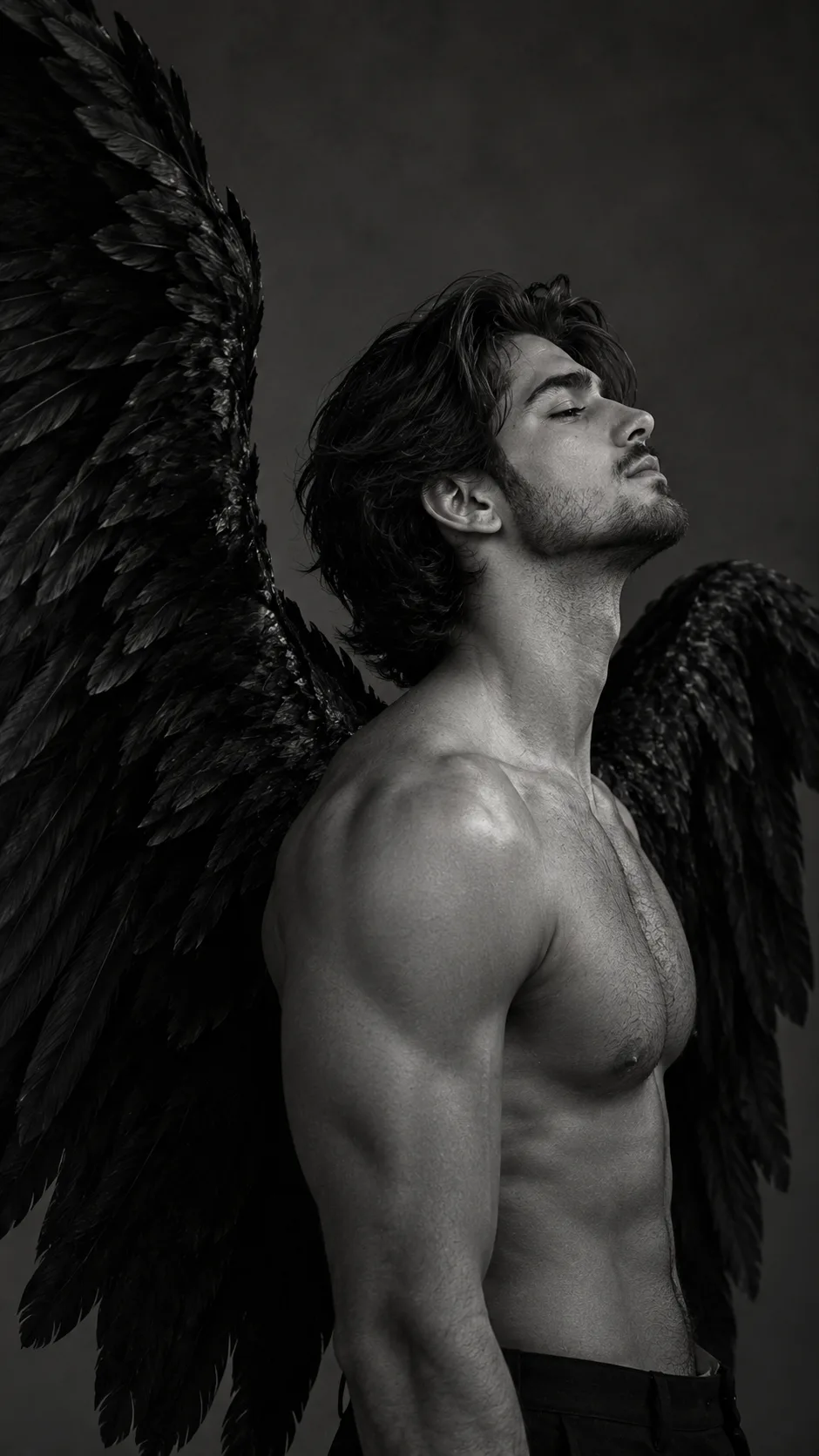 A highly cinematic, ultra-realistic black-and-white fine art portrait of a handsome young adult man with large, majestic black raven wings
